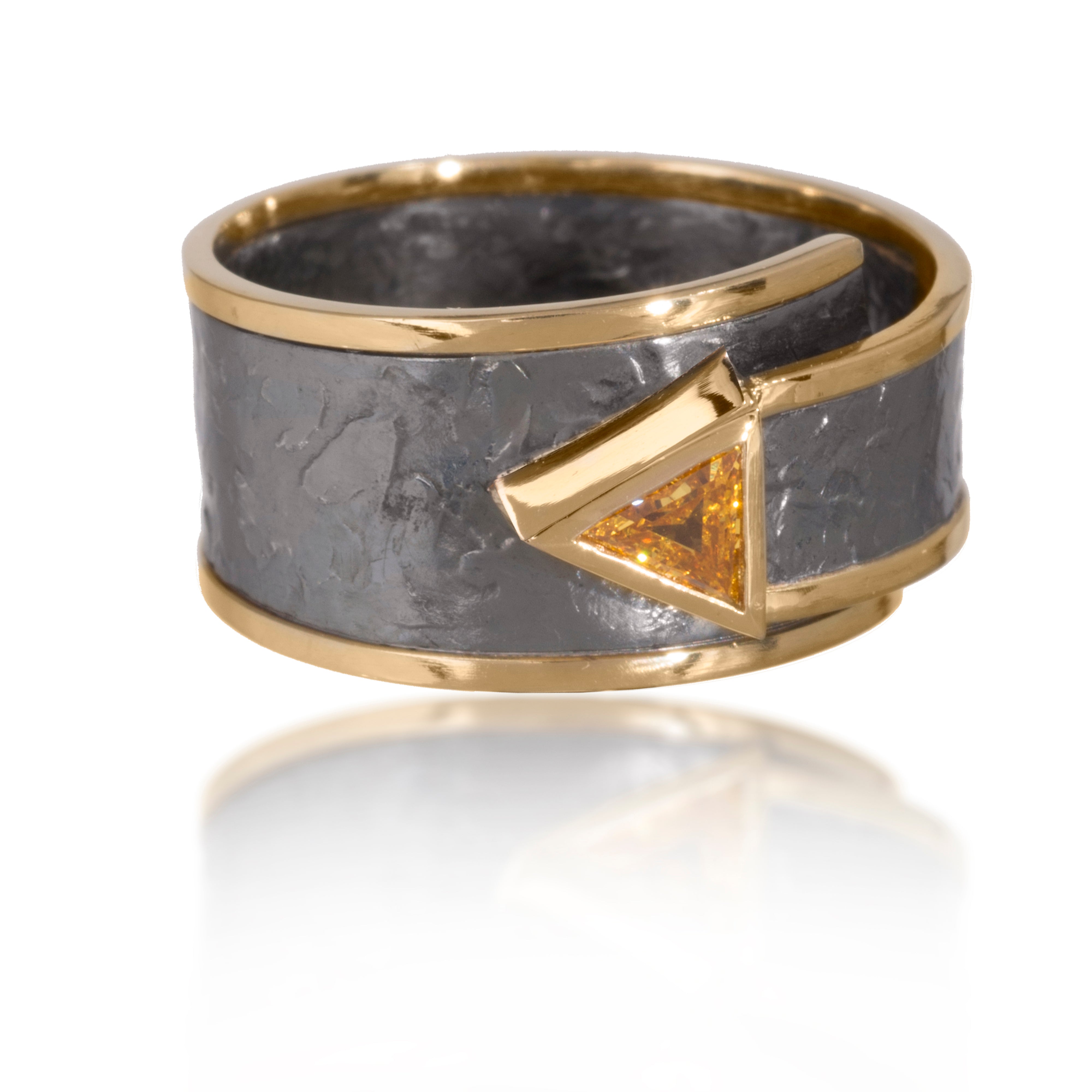 This simple, yet distinctive, one of kind ring in 18k gold and oxidized silver features a bezel set, angular shaped, natural diamond, 0.17 tcw. It is forged, textured and fabricated by hand.