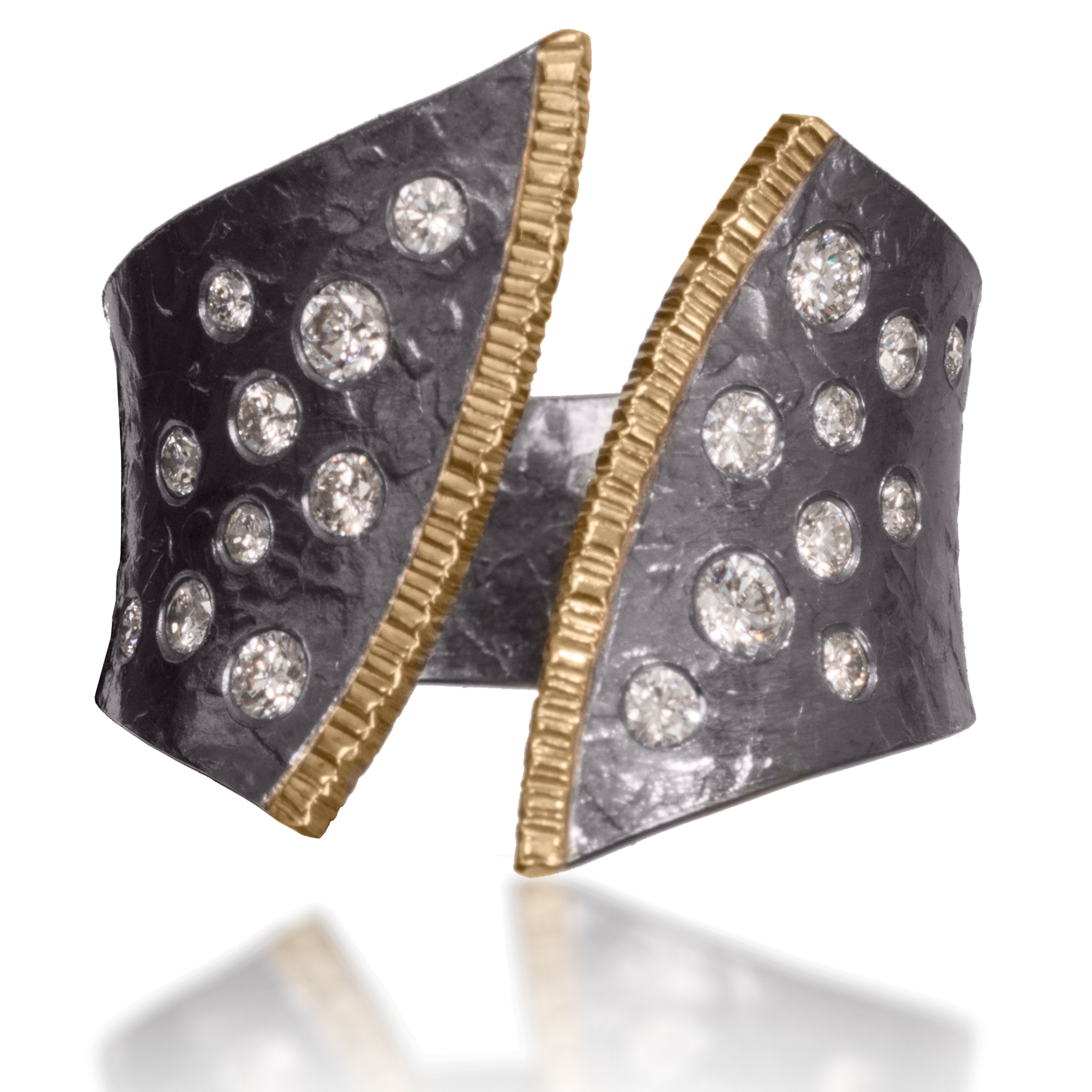 This dazzling ring has been created in 18k gold and oxidized silver and is flush set assorted diamonds It is hand fabricated and features a hammered textured. Currently available in four color ways. As shown, 0.50 tcw.