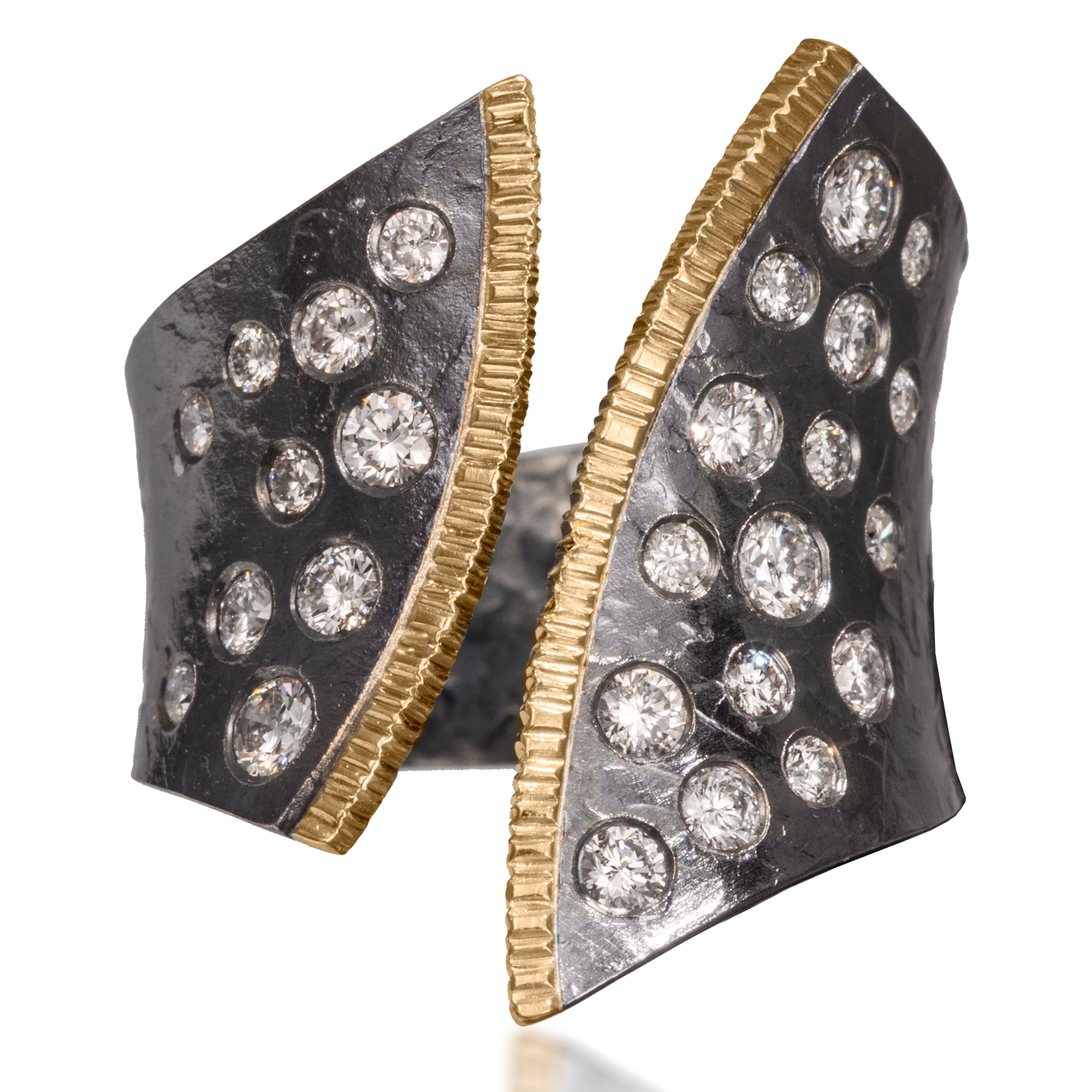 This dazzling ring has been created in 18k gold and oxidized silver and is flush set assorted diamonds. It is hand fabricated and features a hammered textured. Currently available in four color ways. As shown, 0.65 tcw.