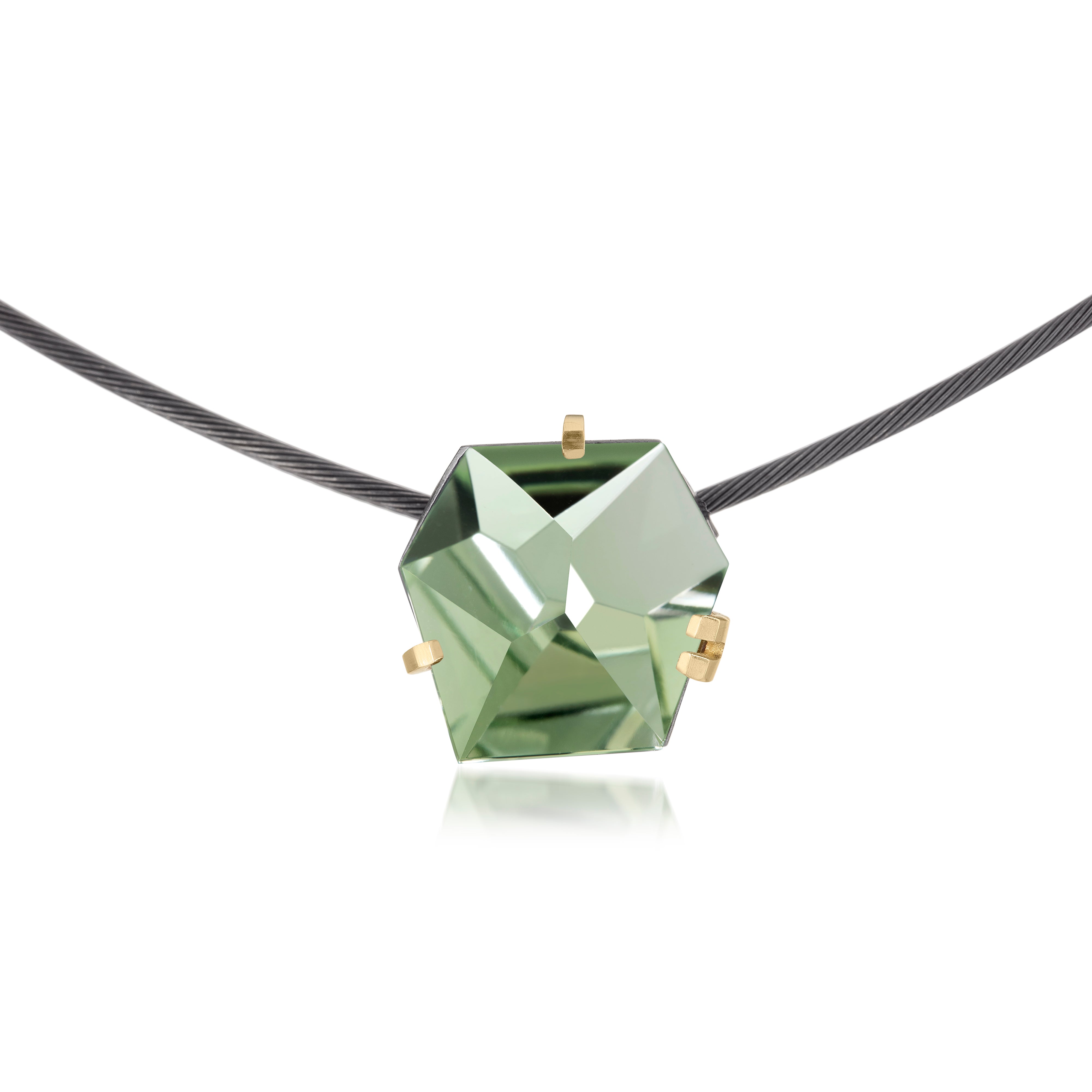 This small size Facets necklace of natural gemstone is set in oxidized silver. Clean lines and a geometric form join to create this neckpiece with a unique, hand cut faceted chunk of gemstone prong set in 18k gold, coupled with a simple neckring of oxidized sterling. Necklace features a friction tube clasp to produce a continuous, uninterrupted line. Gemstone 8.5 tcw.