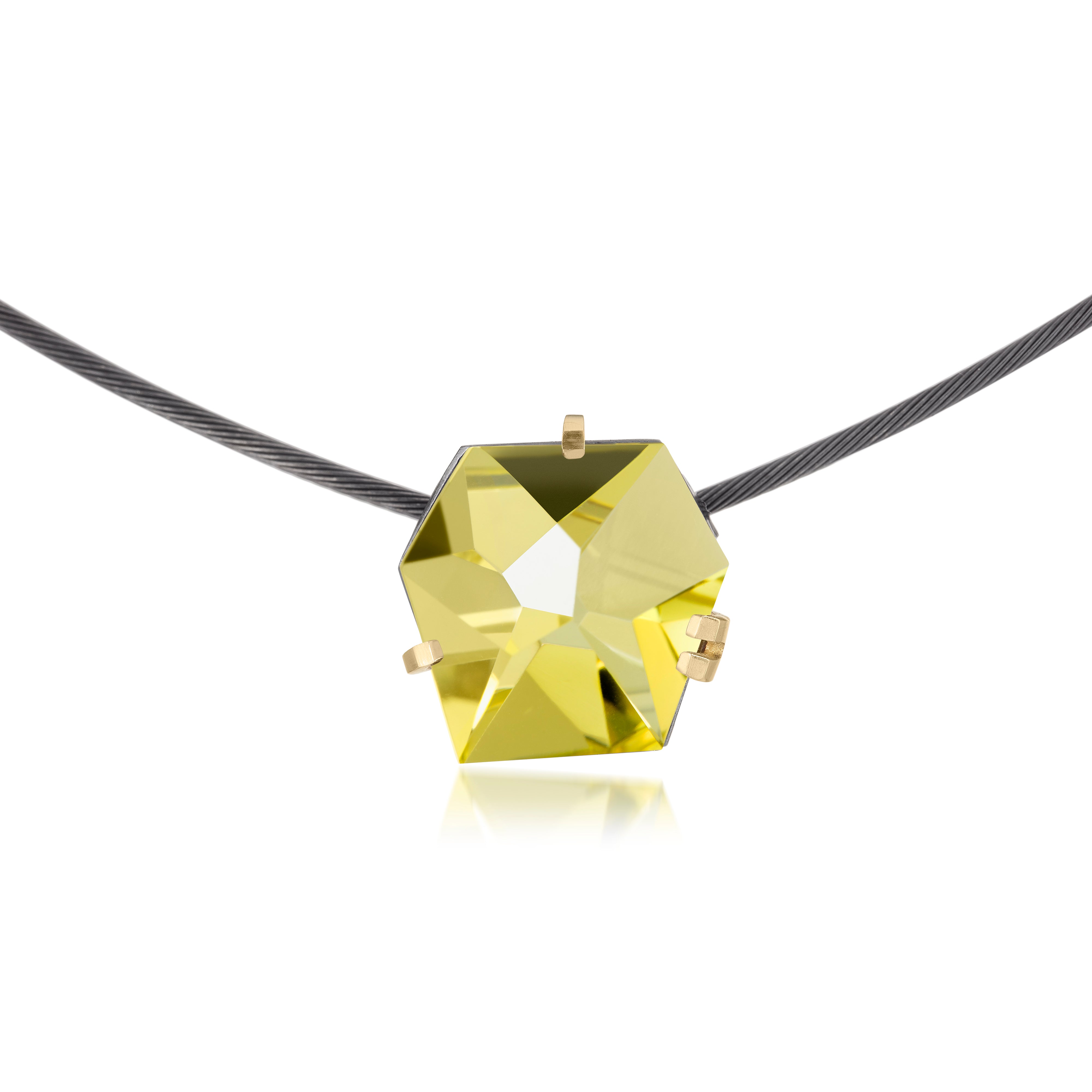 This small size Facets necklace of natural gemstone is set in oxidized silver. Clean lines and a geometric form join to create this neckpiece with a unique, hand cut faceted chunk of gemstone prong set in 18k gold, coupled with a simple neckring of oxidized sterling. Necklace features a friction tube clasp to produce a continuous, uninterrupted line. Gemstone 8.5 tcw.