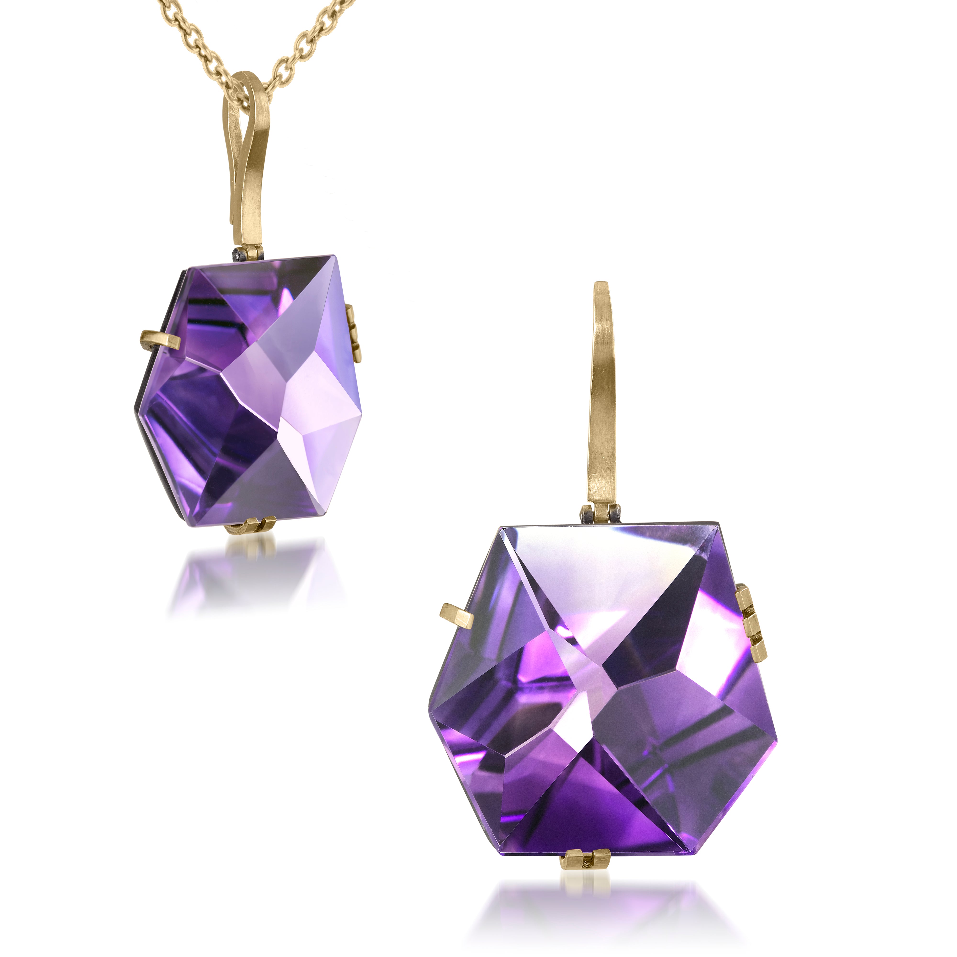 This large Facets pendant in oxidized sterling and 18k gold is set with natural gemstone. The irresistible, oversized gem pendant has amazing presence. Unique, hand cut faceted chunks of gemstone prong set in 18k gold prongs hanging from a small bail of 18k gold or oxidized silver.
