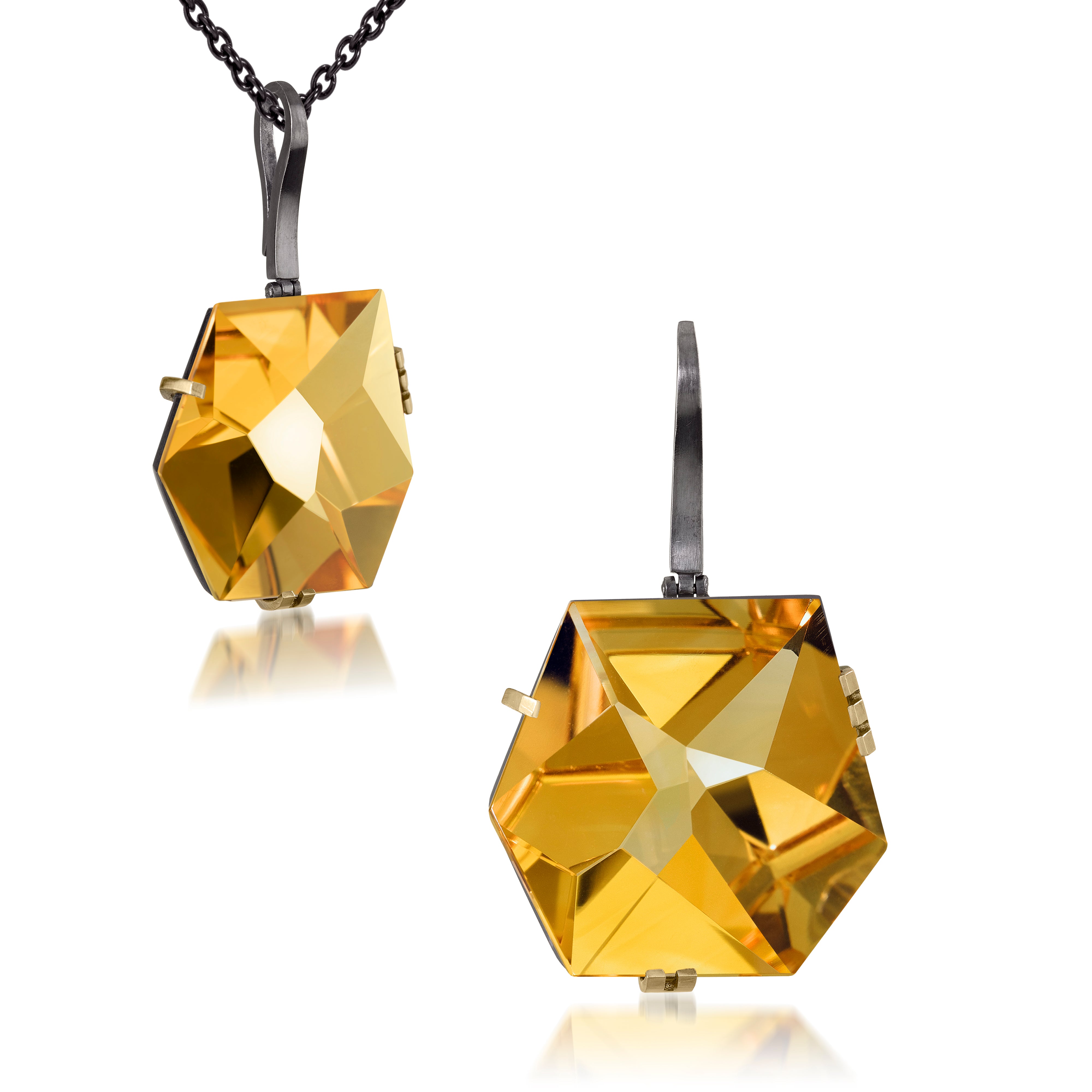 This large Facets pendant in oxidized sterling and 18k gold is set with natural gemstone. The irresistible, oversized gem pendant has amazing presence. Unique, hand cut faceted chunks of gemstone prong set in 18k gold prongs hanging from a small bail of 18k gold or oxidized silver.  