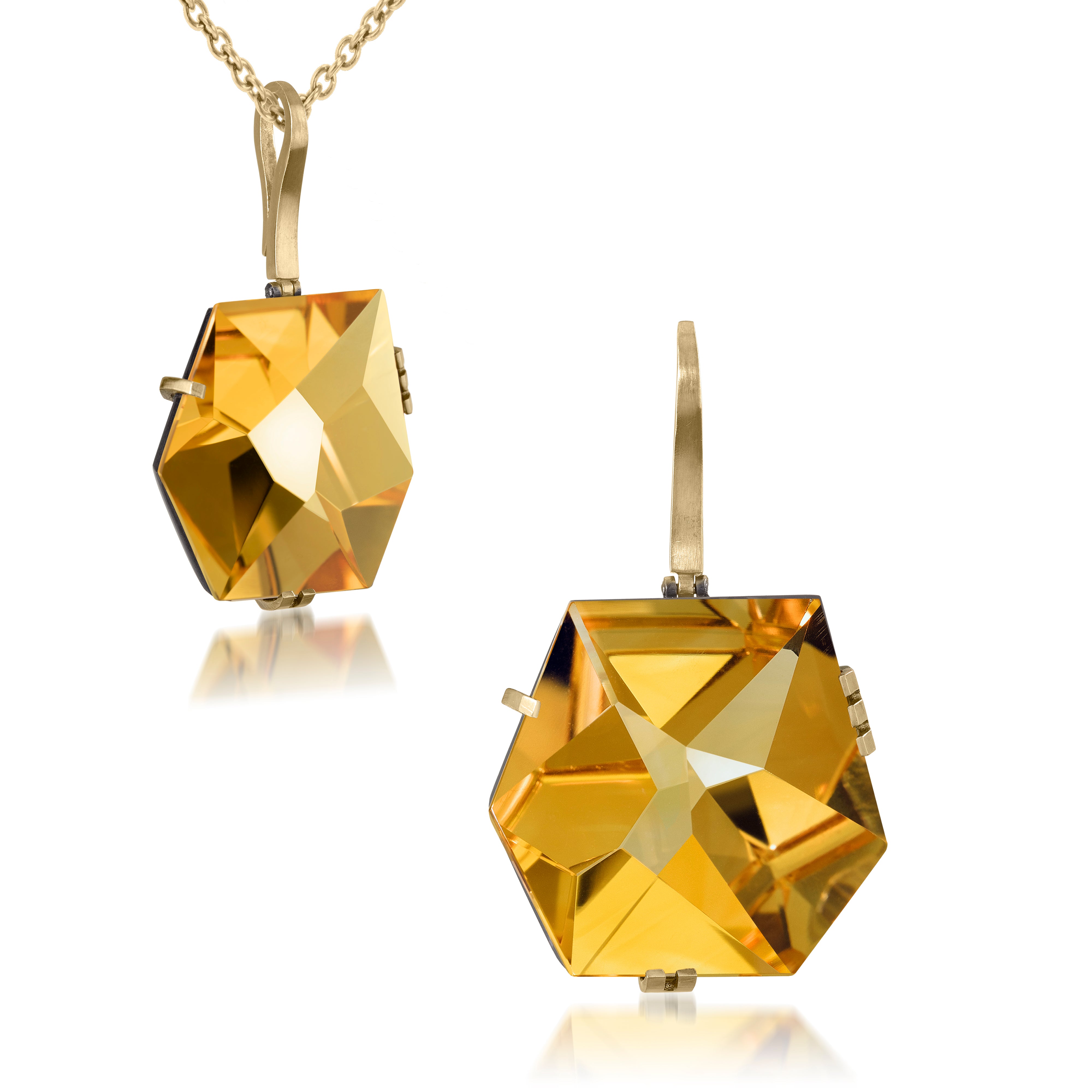 This large Facets pendant in oxidized sterling and 18k gold is set with natural gemstone. The irresistible, oversized gem pendant has amazing presence. Unique, hand cut faceted chunks of gemstone prong set in 18k gold prongs hanging from a small bail of 18k gold or oxidized silver.