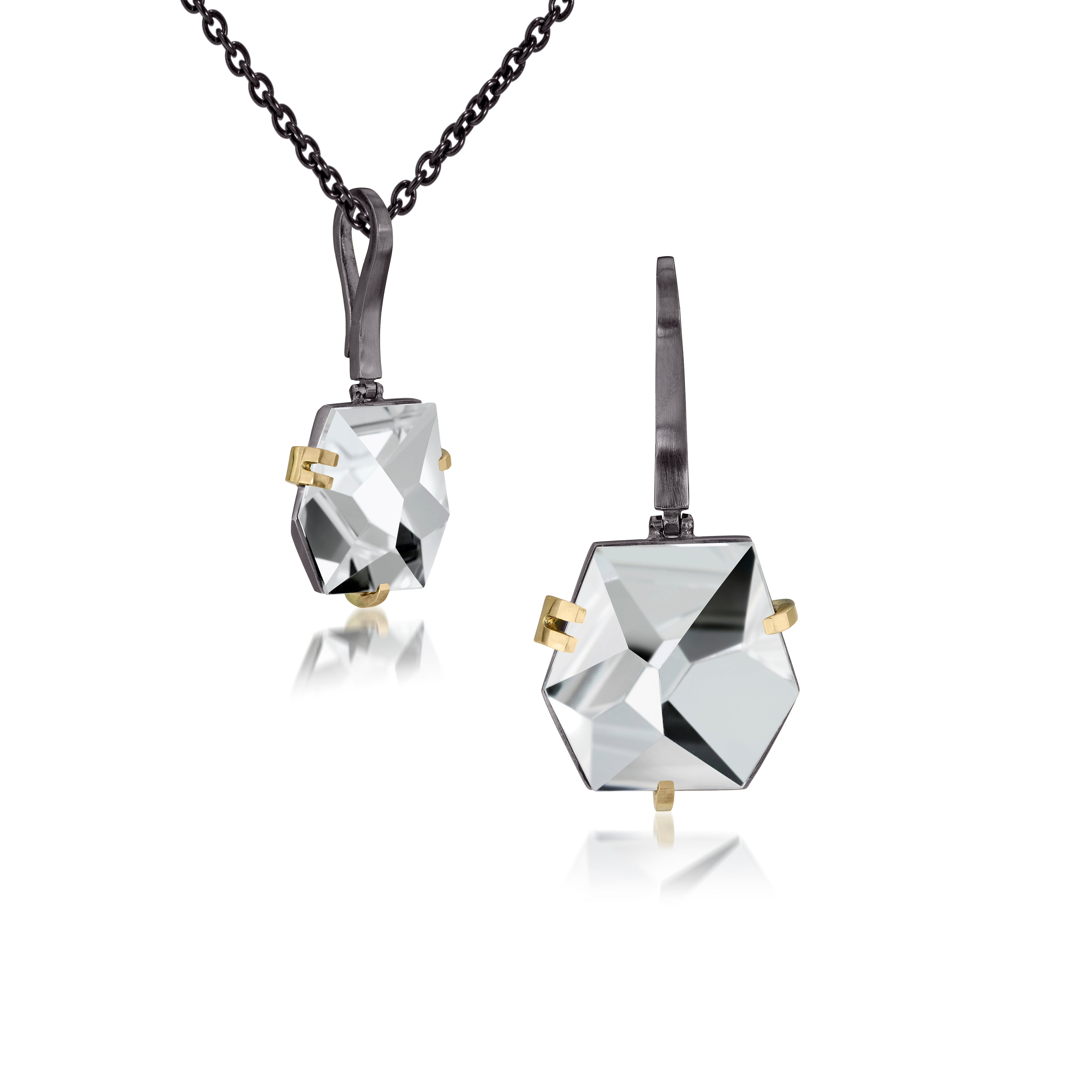 This small Facets pendant in oxidized sterling and 18k is set with natural gemstone. Unique, hand cut faceted chunks of gemstone are prong set in 18k gold prongs hang from a small bail of 18k gold or oxidized silver.