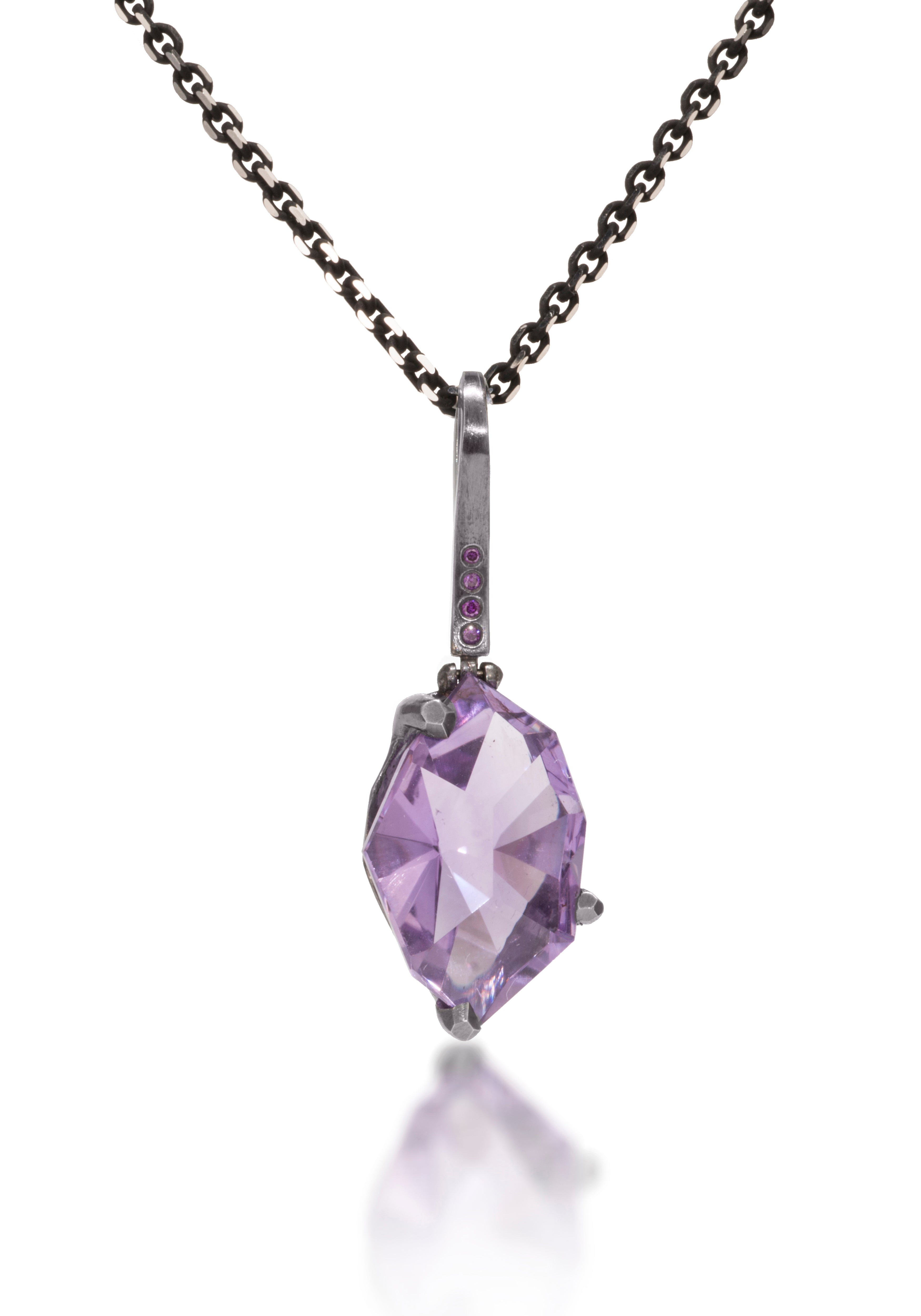 This small size Facets pendant is natural gemstone set in oxidized silver. Unique, hand cut, faceted chunks of gemstone are set in faceted prongs of oxidized silver, hanging from a small bail set with four color coordinated diamonds. Available in six color ways. Gemstone 7.0+ tcw, Dia. 0.0276 tcw.