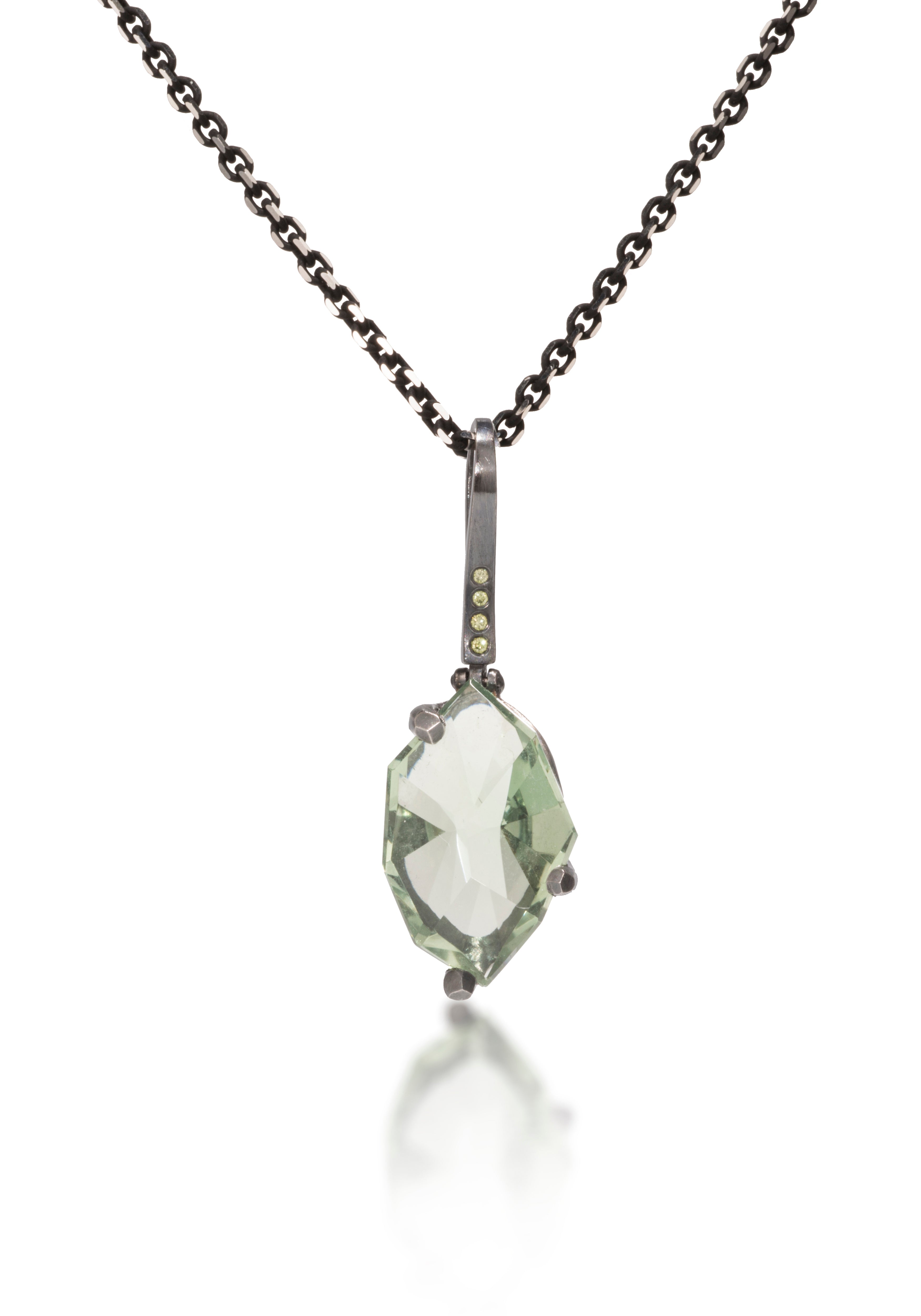 This small size Facets pendant is natural gemstone set in oxidized silver. Unique, hand cut, faceted chunks of gemstone are set in faceted prongs of oxidized silver, hanging from a small bail set with four color coordinated diamonds. Available in six color ways. Gemstone 7.0+ tcw, Dia. 0.0276 tcw.