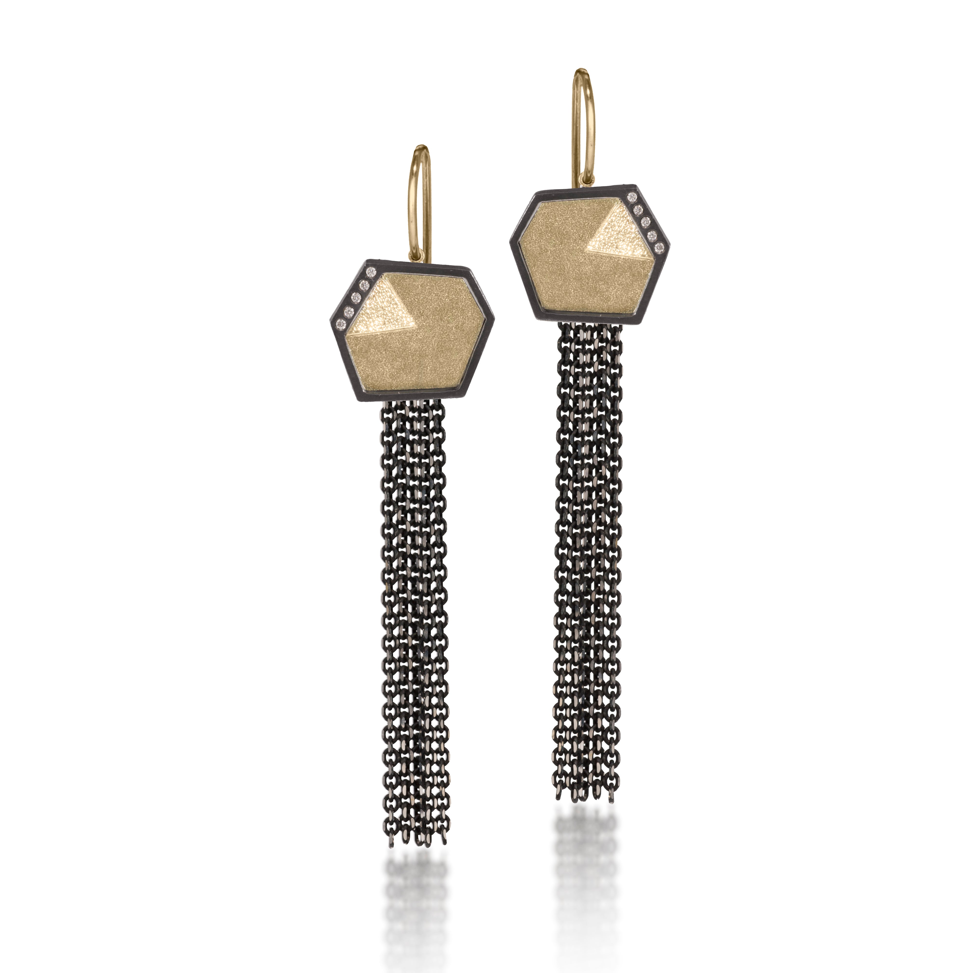 This earring in oxidized sterling silver and richly textured 18k bimetal, is flush set with ideal cut white diamonds. It features 14k gold posts or 18k gold earwires. Accent facet glitters with the texture of diamond facets, individually scored and textured. Small size. Available in post, drop or fringed styles. 0.069 tcw