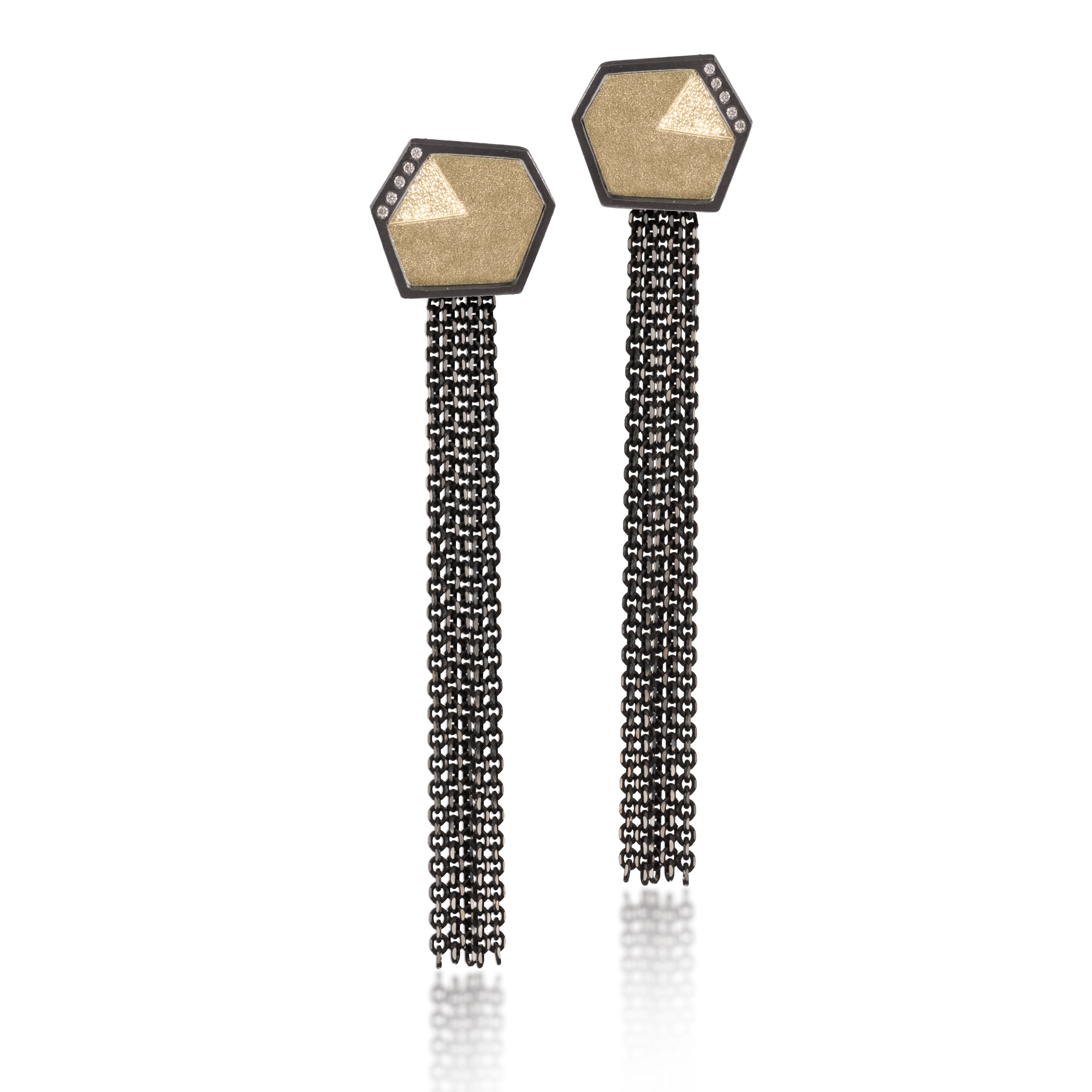 This earring in oxidized sterling silver and richly textured 18k bimetal, is flush set with ideal cut white diamonds. It features 14k gold posts or 18k gold earwires. Accent facet glitters with the texture of diamond facets, individually scored and textured. Small size. Available in post, drop or fringed styles. 0.069 tcw