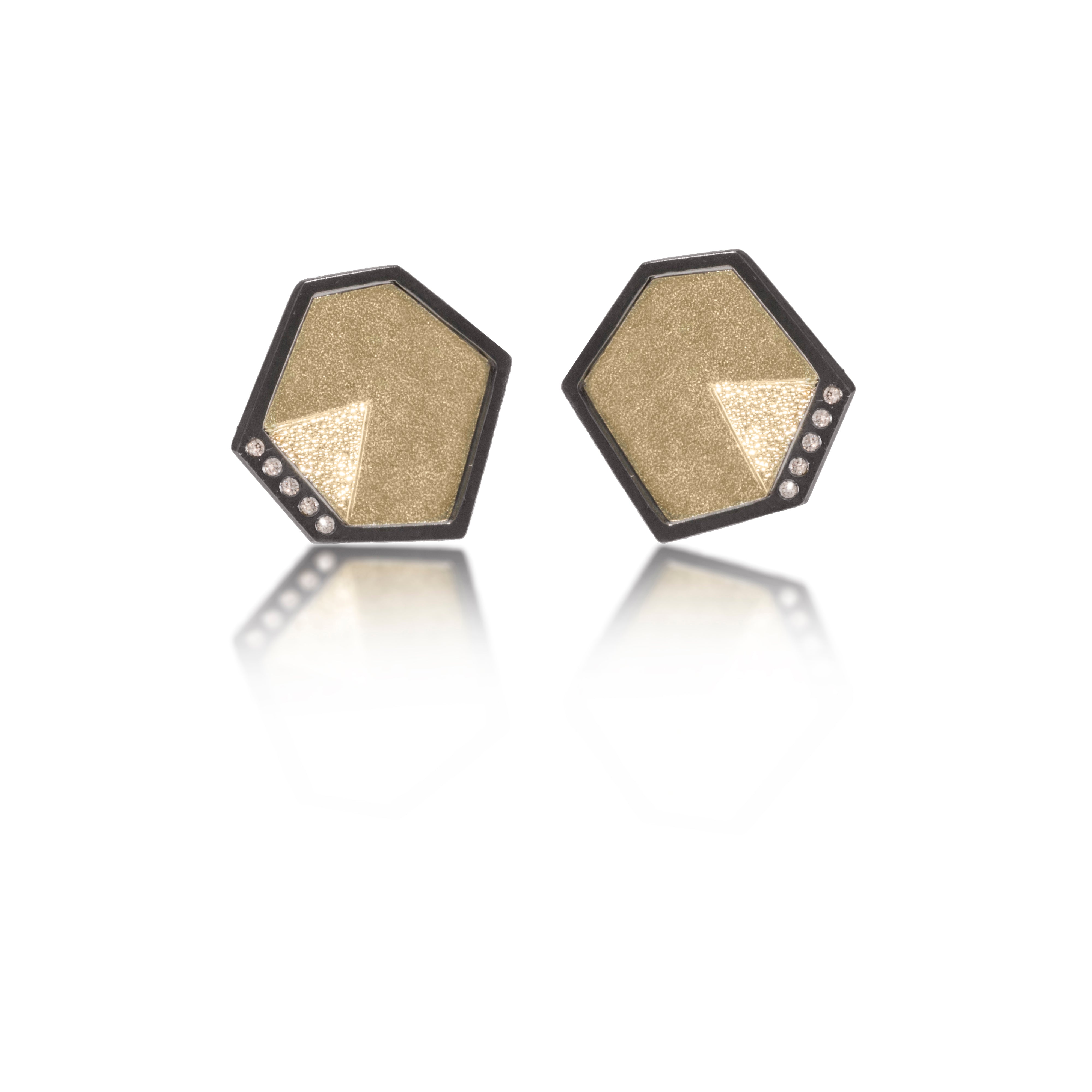 This earring in oxidized sterling silver and richly textured 18k bimetal, is flush set with ideal cut white diamonds. It features 14k gold posts or 18k gold earwires. Accent facet glitters with the texture of diamond facets, individually scored and textured. Small size. Available in post, drop or fringed styles. 0.069 tcw