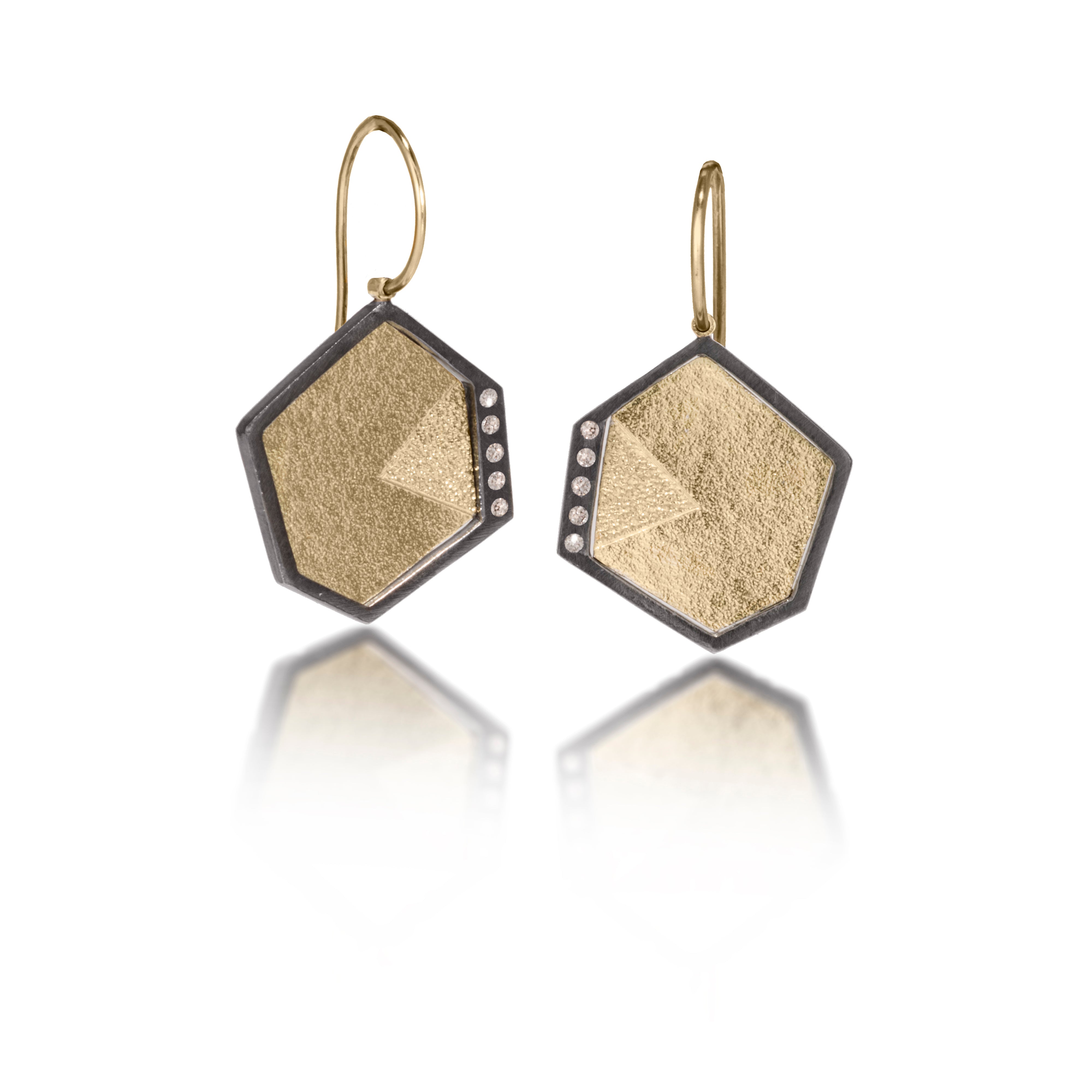 This earring in oxidized sterling silver and richly textured 18k bimetal, is flush set with ideal cut white diamonds. It features 14k gold posts or 18k gold earwires. Accent facet glitters with the texture of diamond facets, individually scored and textured. Small size. Available in post, drop or fringed styles. 0.069 tcw