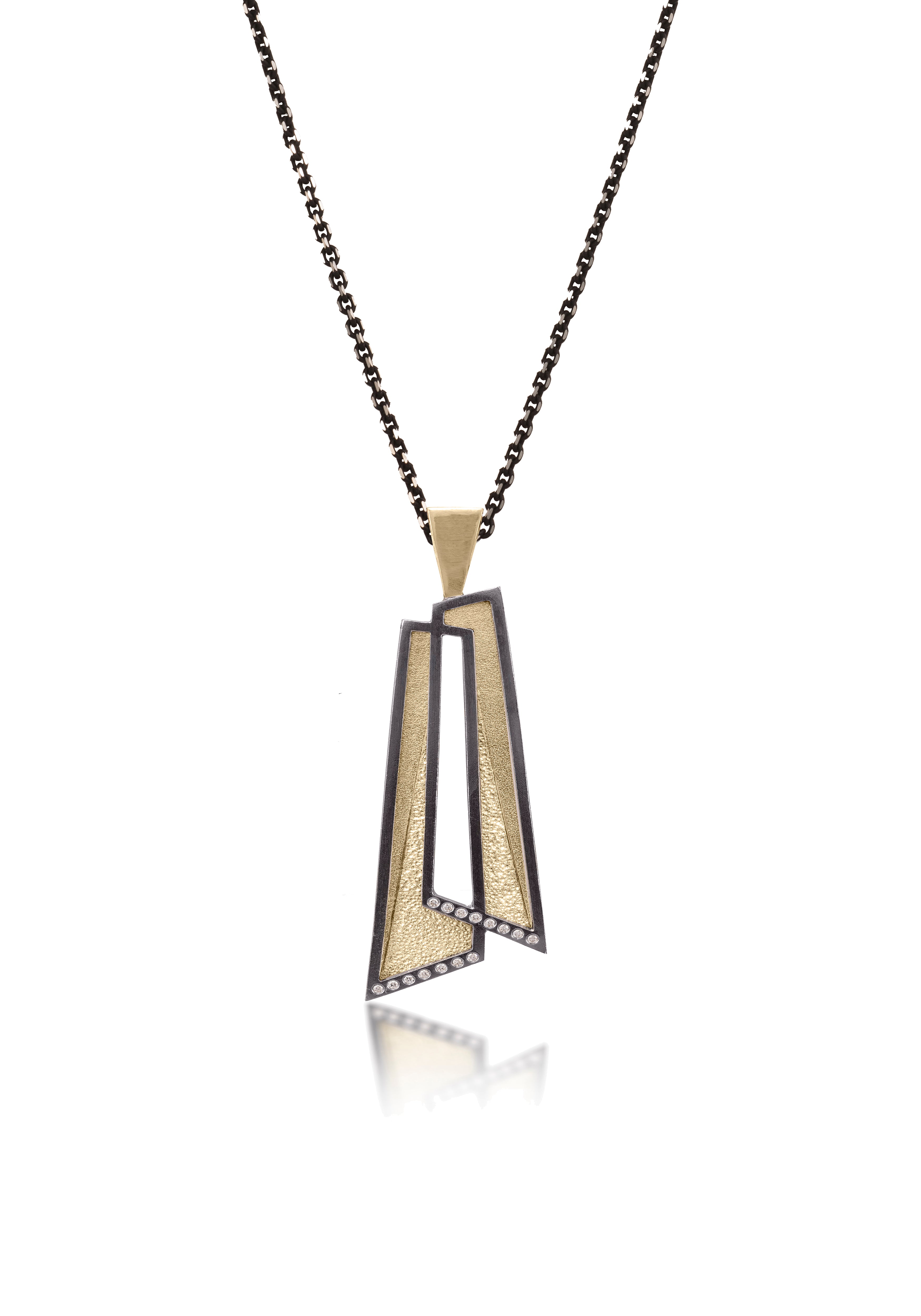 This oxidized sterling silver and richly textured 18k bimetal pendant is flush set with ideal cut white diamonds.  Accent facet glitters with the texture of diamond facets, individually scored and textured. Overlapping shapes with open areas.  Available with oxidized silver or 18k gold bail.  0.0483 tcw