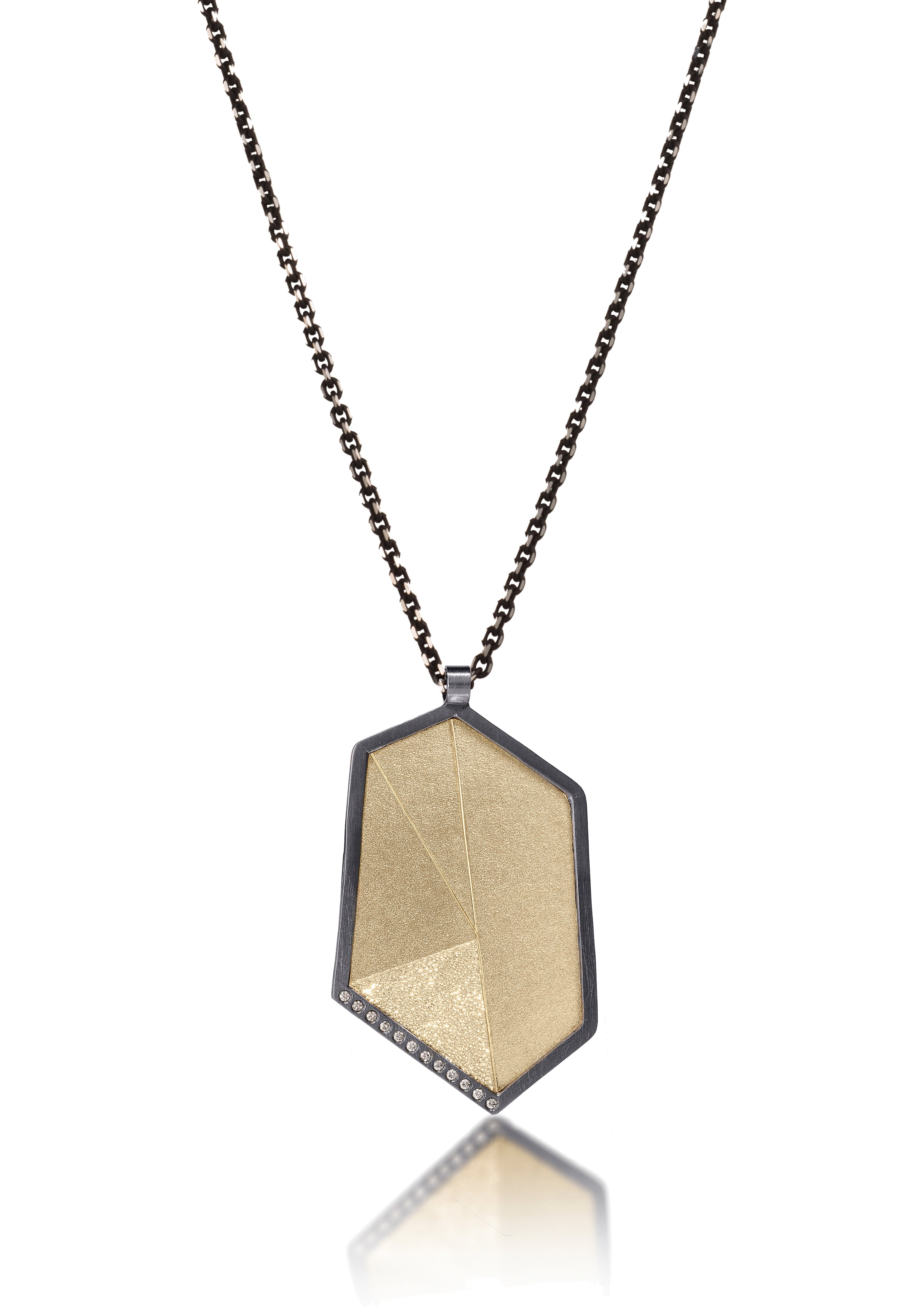 This oxidized sterling silver and richly textured 18k bimetal pendant is flush set with ideal cut white diamonds. Accent facet glitters with the texture of diamond facets, individually scored and textured. Size extra large. Hinged bail of oxidized sterling available in 3.25mm, elongated fixed and elongated enhancer styles. 0.0828 tcw