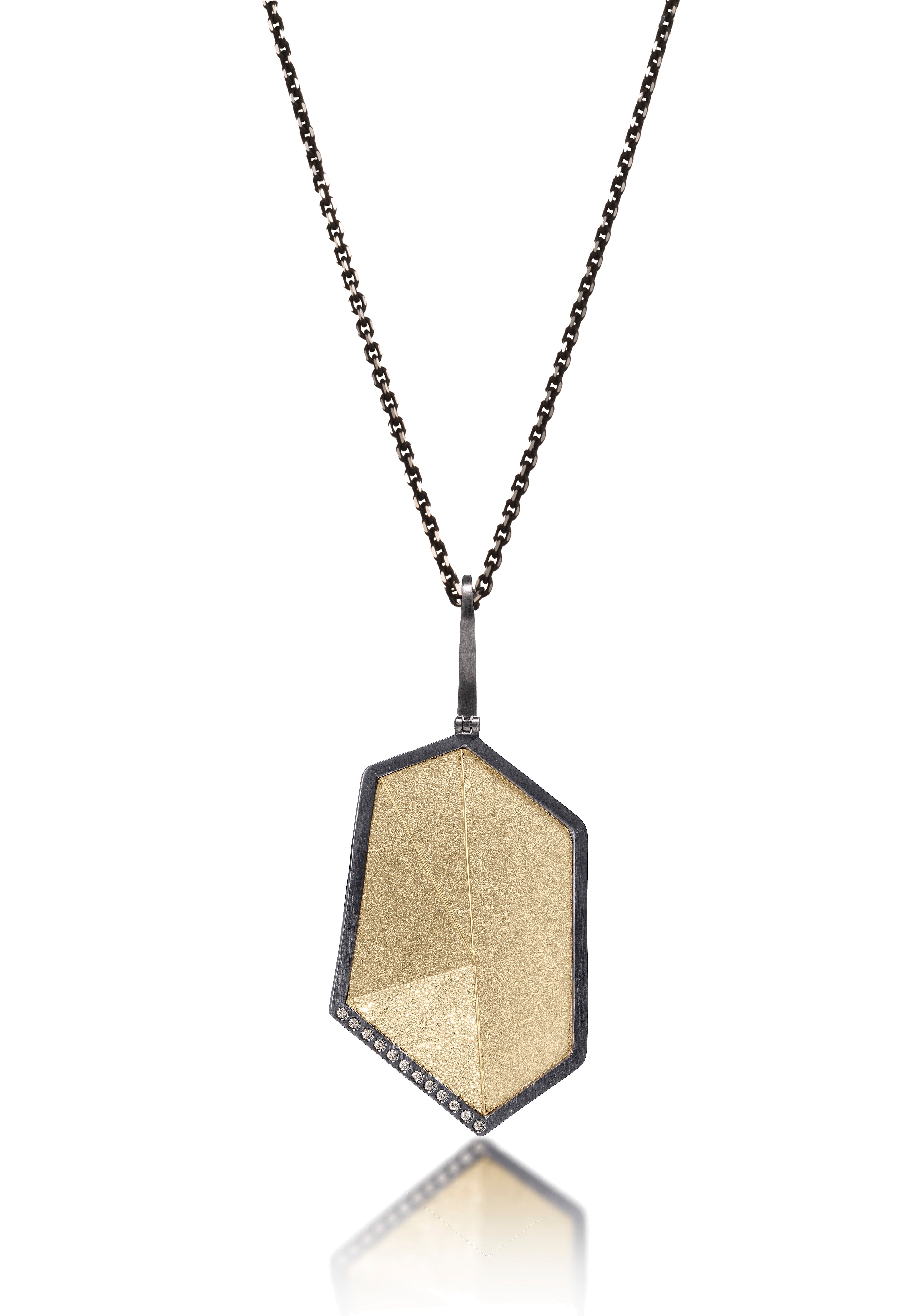 This oxidized sterling silver and richly textured 18k bimetal pendant is flush set with ideal cut white diamonds. Accent facet glitters with the texture of diamond facets, individually scored and textured. Size extra large. Hinged bail of oxidized sterling available in 3.25mm, elongated fixed and elongated enhancer styles. 0.0828 tcw