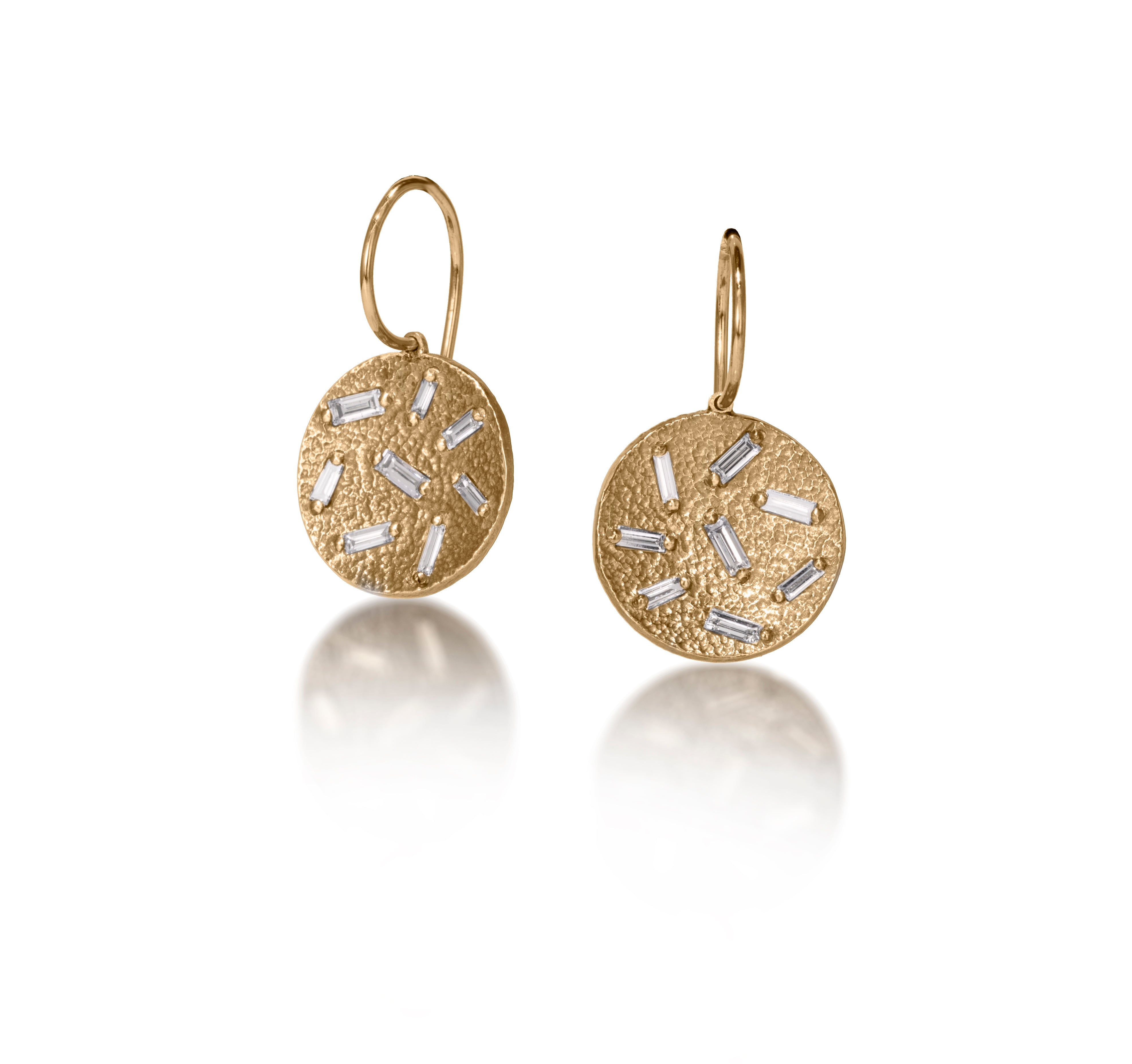 This is a simple, elegant, perfect everyday earring.  Offered in three richly textured color ways, oxidized sterling with 18k ear wire, 18k gold, palladium.  Each earring set with 8 white diamond baguettes. 0.454 tcw.