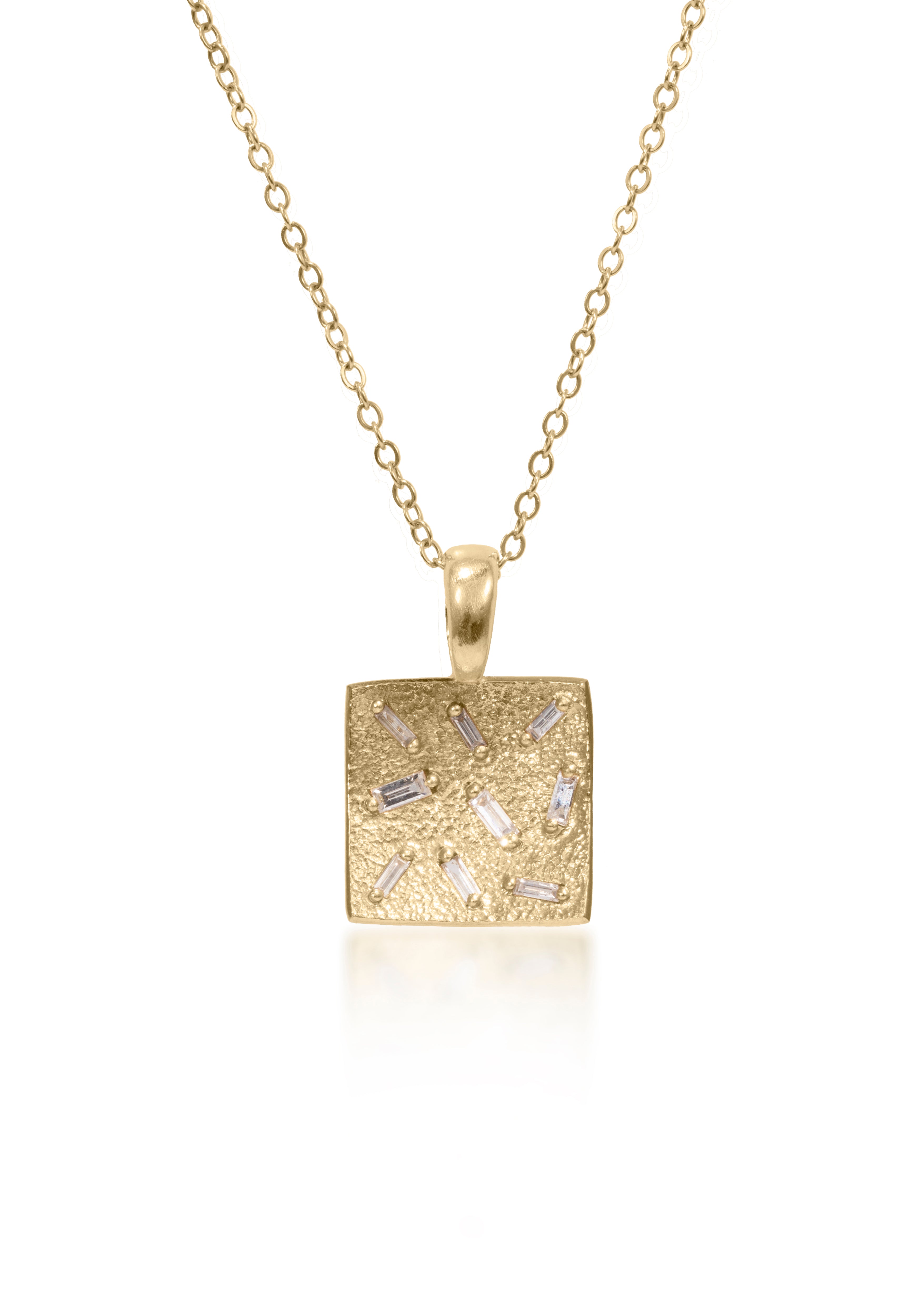 This stunning, small square pendant is set with 9 white diamond baguettes. Richly textured to shimmer in the light, this piece is available in three color ways, oxidized silver, 18k gold and palladium (pictured).  0.245 tcw.