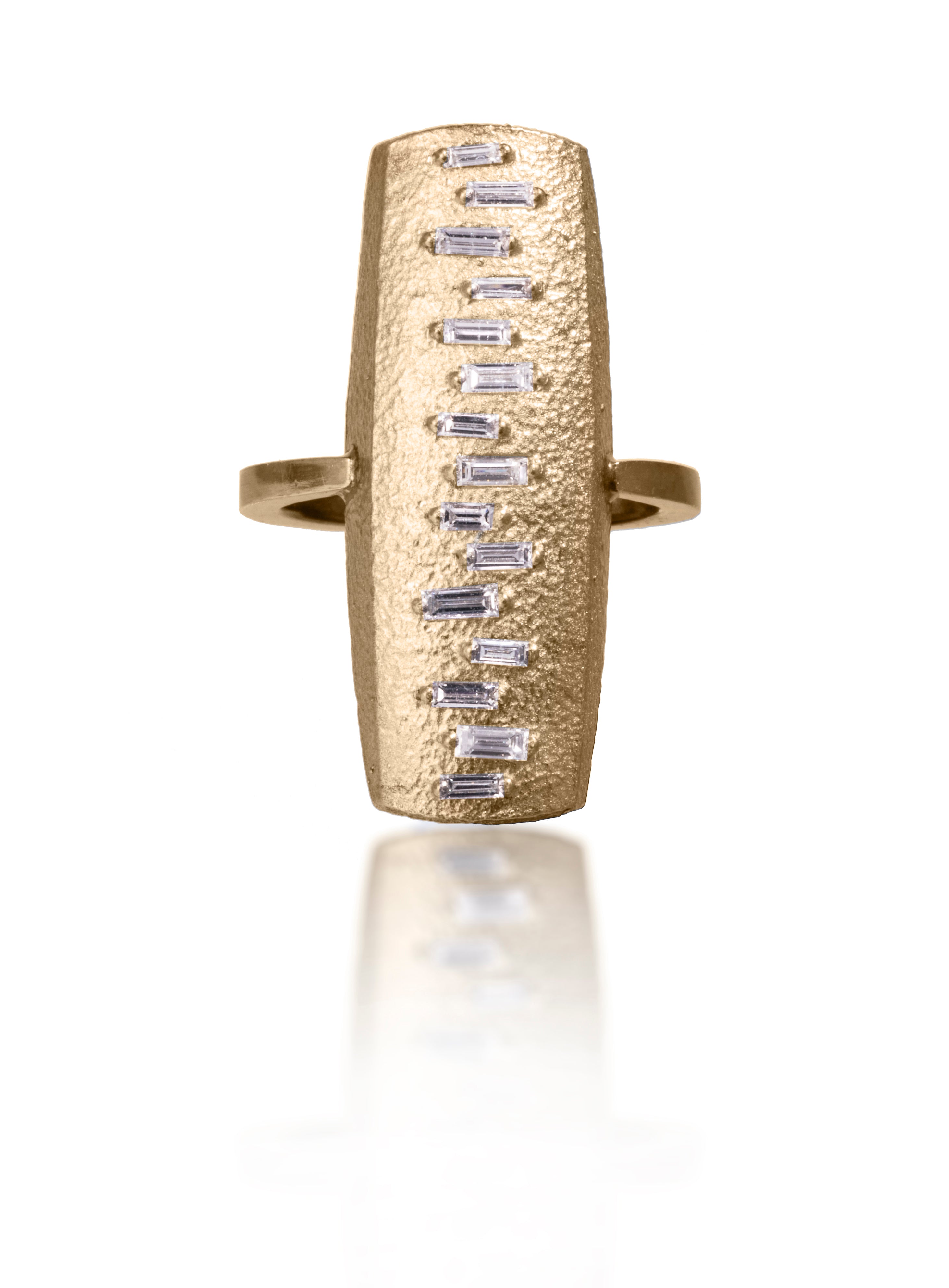 This large pendant ring is set with 15 white diamond baguettes. It is available in three richly textured color ways, oxidized silver, 18k gold, and palladium.  The graceful irregularity of the baguette angles catch the light in exciting ways when worn. 0.4713 tcw.