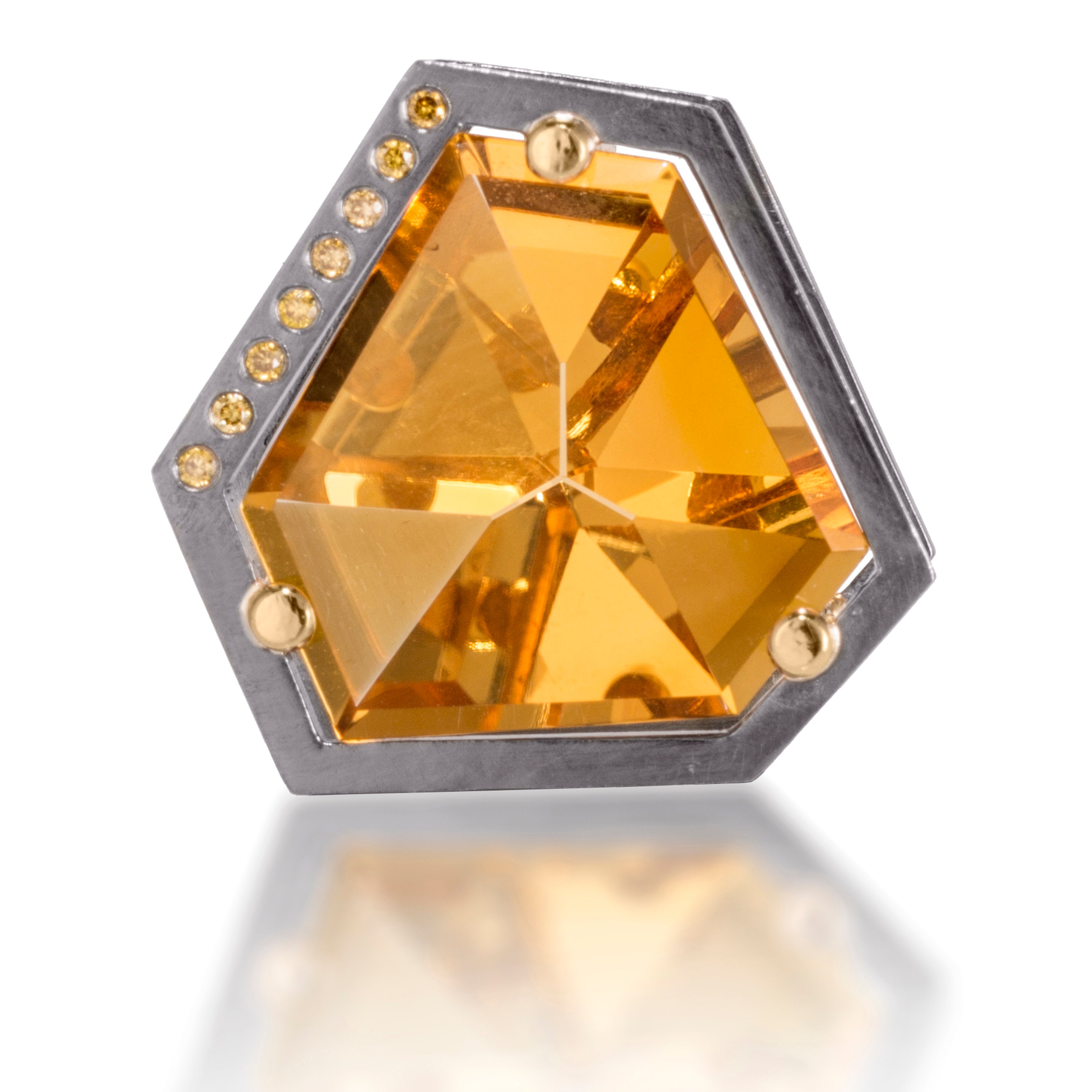 This angular pendant features a custom cut, semiprecious stone, set with an oxidized silver frame and 18k gold posts, flush set with color matched diamonds. Semiprecious stone 12.75 tcw., diamonds 0.058 tcw.