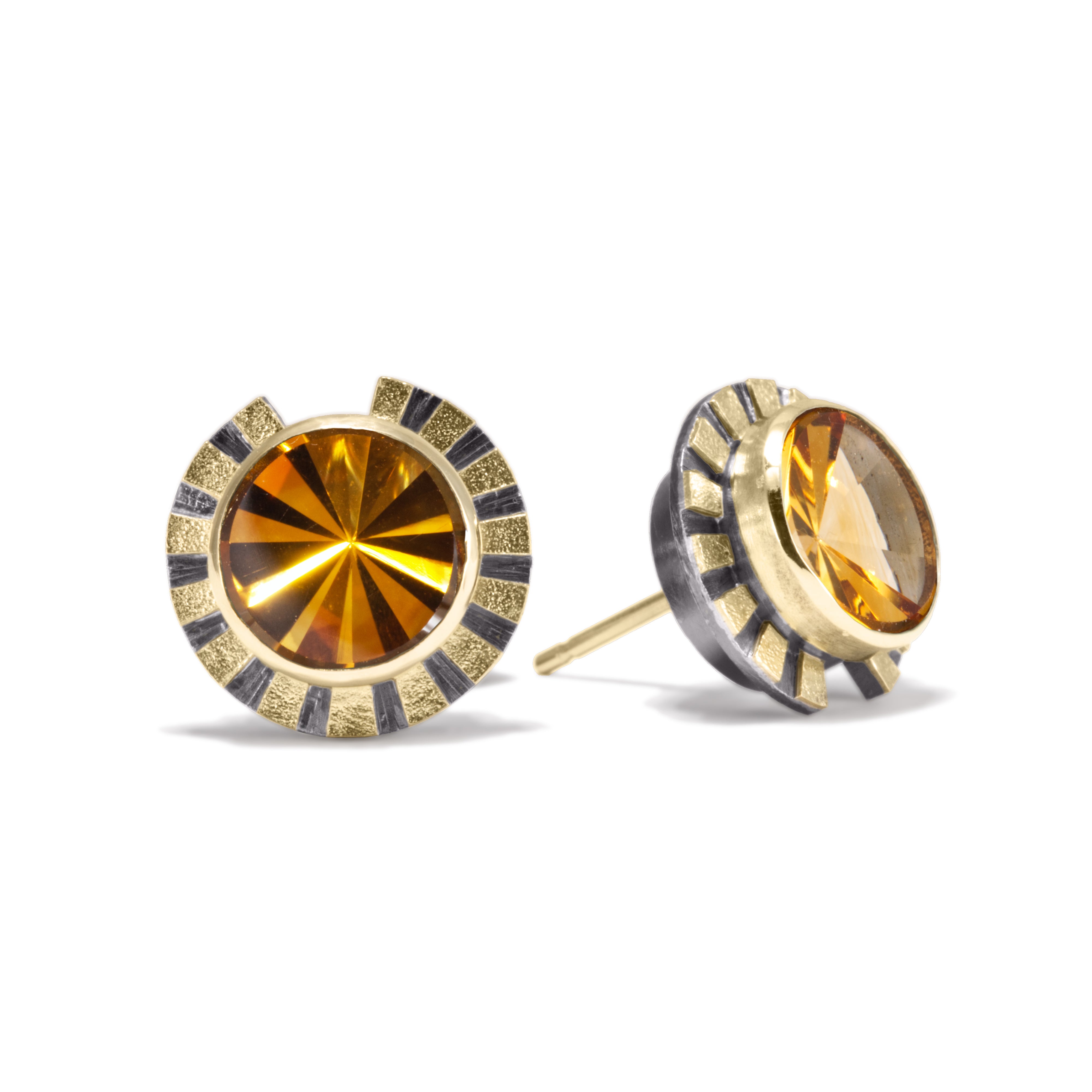 This is the refined and dazzling Striped Earring #1. Made in 18k gold and oxidized sterling silver, the design features a bezel set, radial cut, semiprecious center stone. Hand fabricated, stipple textured and engraved mixed metals.  Available in seven color ways, with 14k gold posts.