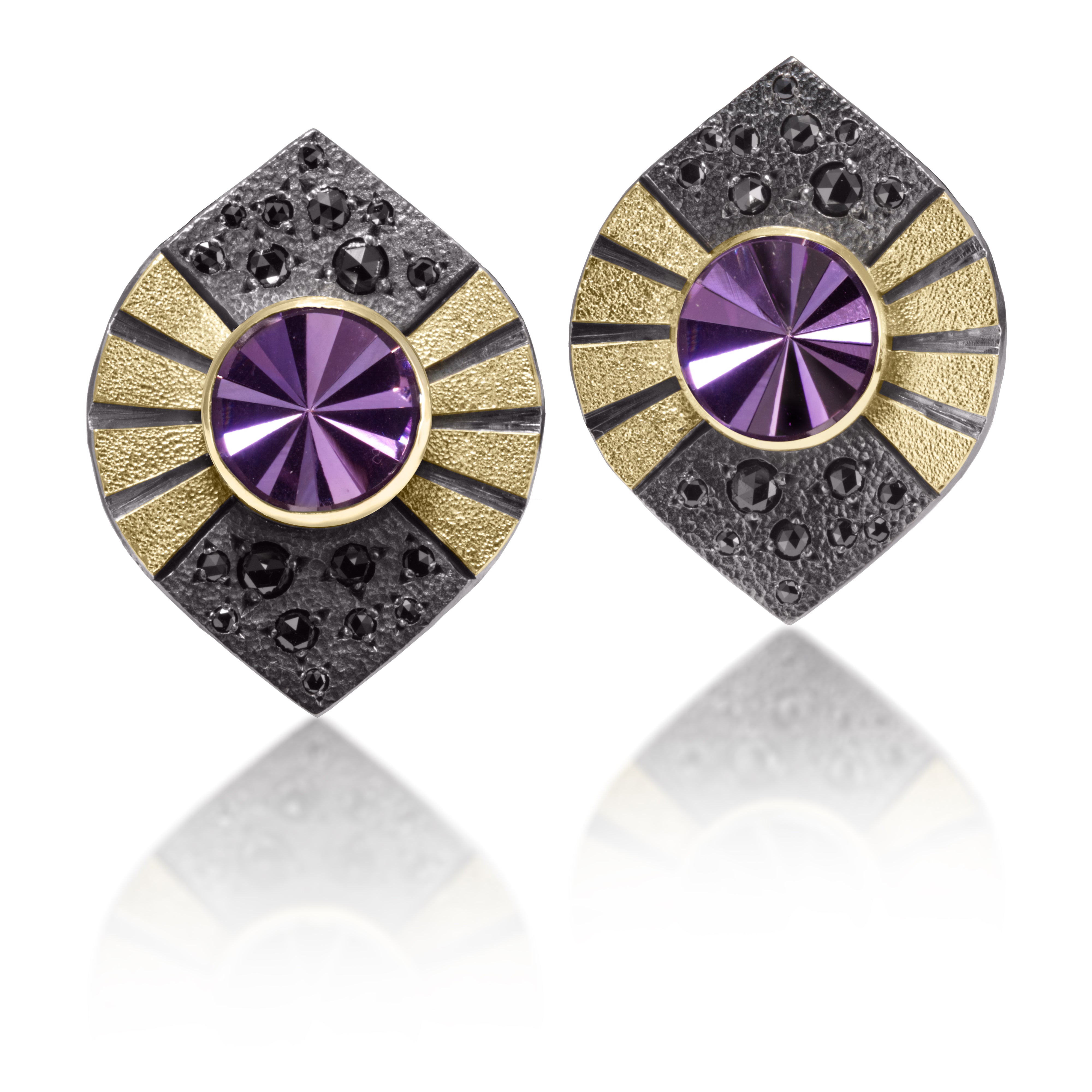 Stripe Earring #3 is a gently curved form in 18k gold and oxidized sterling silver, which features a bezel set, radial cut, semiprecious center stone. Hand fabricated, stipple textured and engraved mixed metals. Bead set, rose cut, black diamonds 0.936 tcw., add a secret shimmer to contrasting areas of oxidized sterling. 14k gold posts.