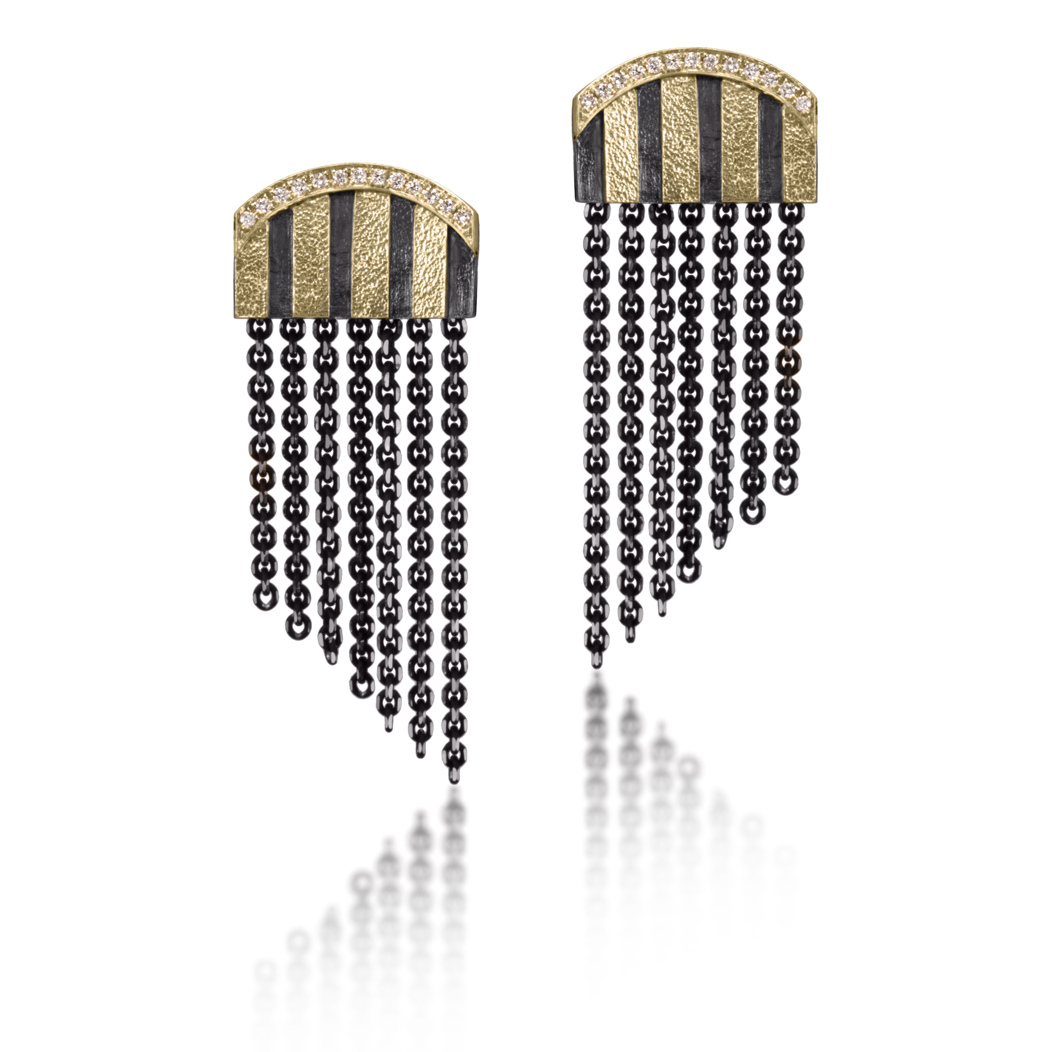 A modern and minimal play on Harlequin drama, the Stripe Earring #6 has everything, diamonds, stripes and fringe! Broad stripes of 18k gold and oxidized sterling silver framed in pavé set white diamonds. Post style earring with 14k gold posts. Hand fabricated, stipple textured and engraved mixed metals.