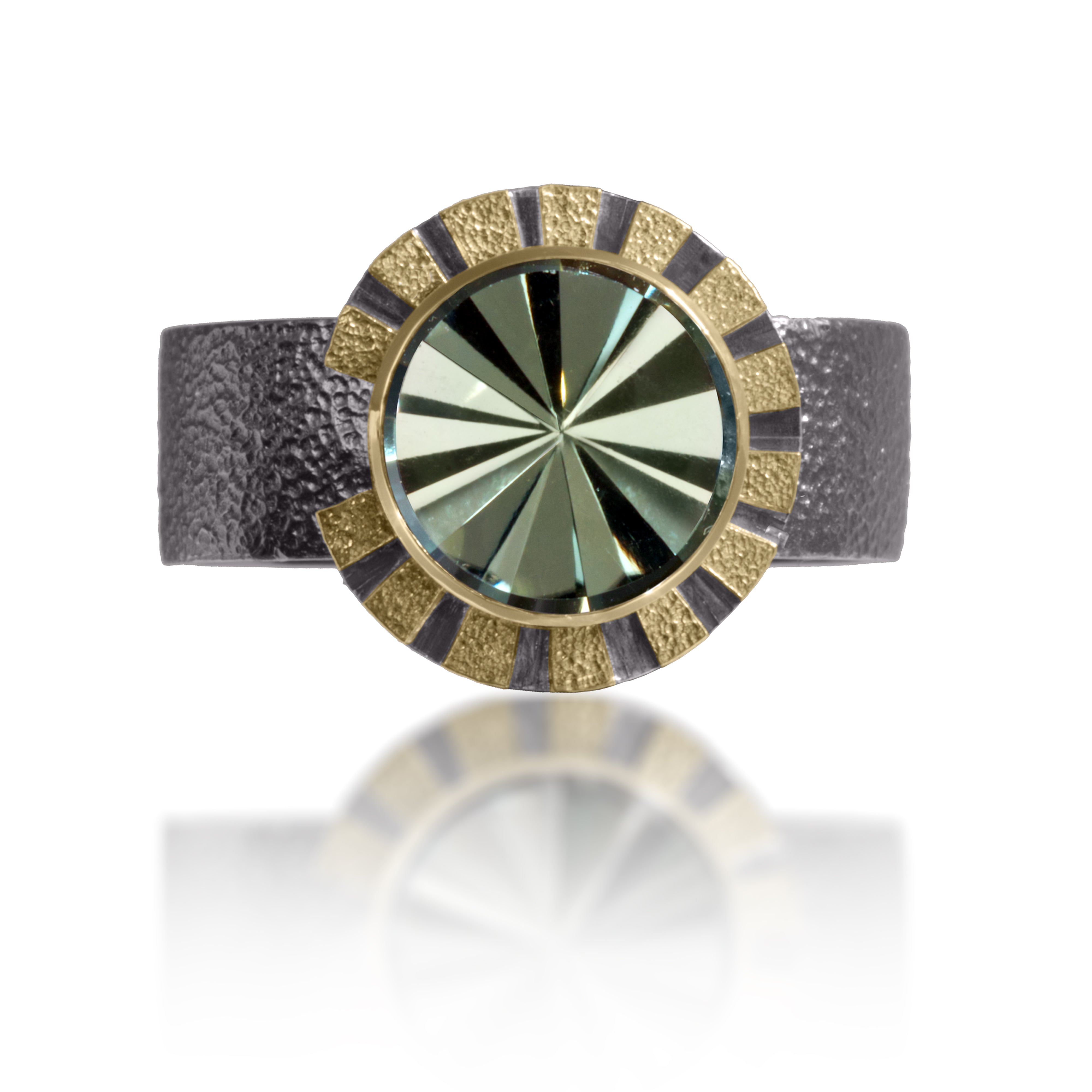 Stripe Ring #1 in 18k gold and oxidized sterling silver with a bezel set radial cut, semiprecious center stone. Hand fabricated, stipple textured and engraved mixed metals. Textured band with rounded “comfort” contour.