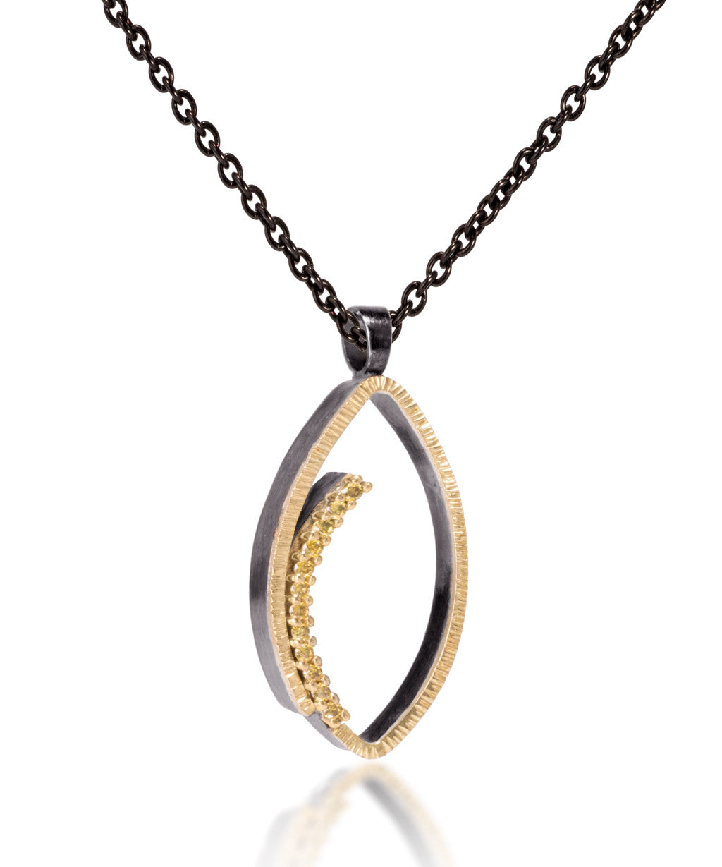 Tempest pendant #1-Medium in 18k gold and oxidized sterling silver with prong set natural yellow diamonds. Forged, textured and fabricated by hand. 0.0864 tcw.