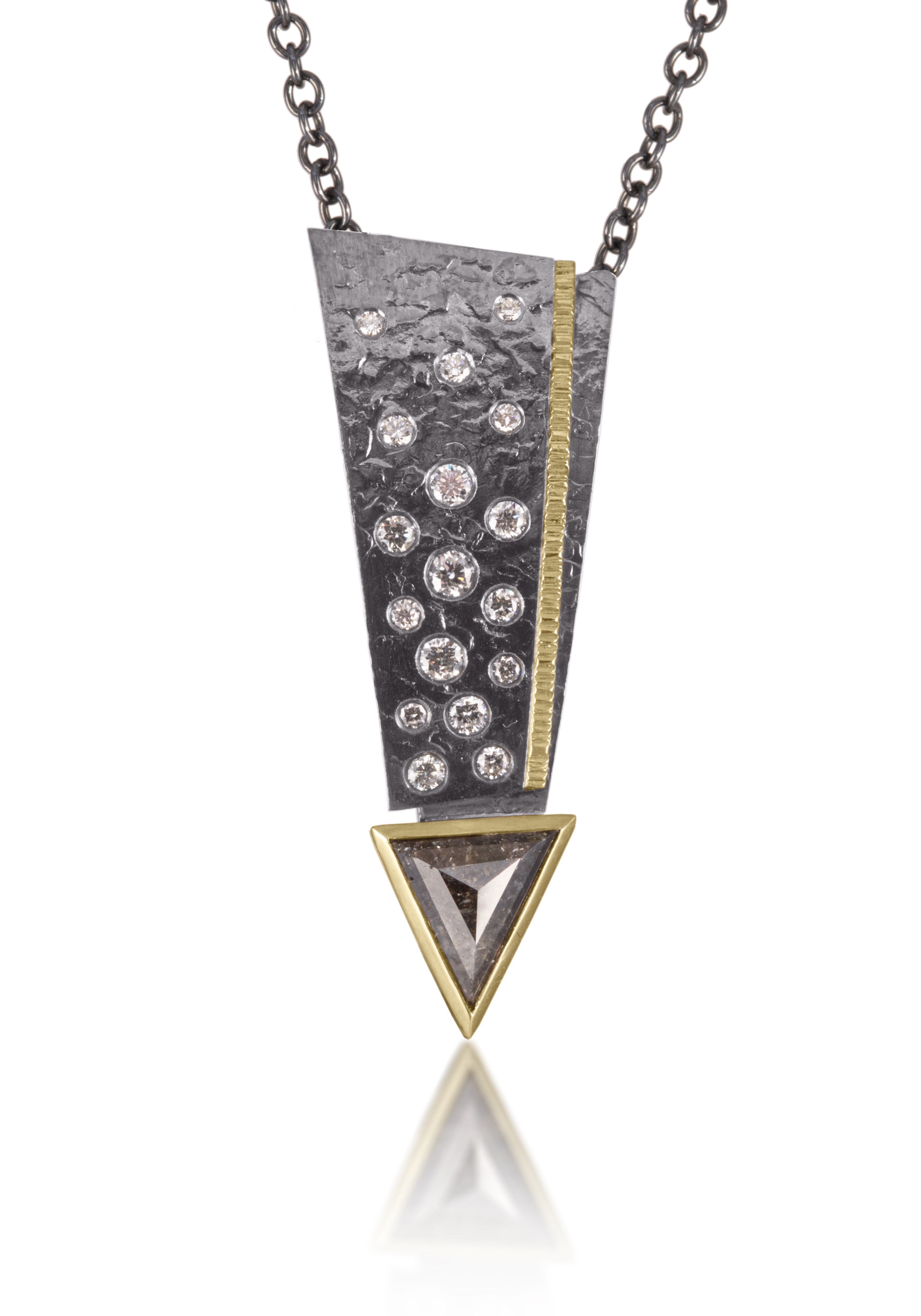 This Cyclone Pendant in 18k gold and oxidized silver is flush set with brilliant cut diamonds.  This statement piece culminates with a carre cut diamond exclamation point, elegantly framed in 18k gold. Hand fabricated, hammer texture 0.58 tcw.