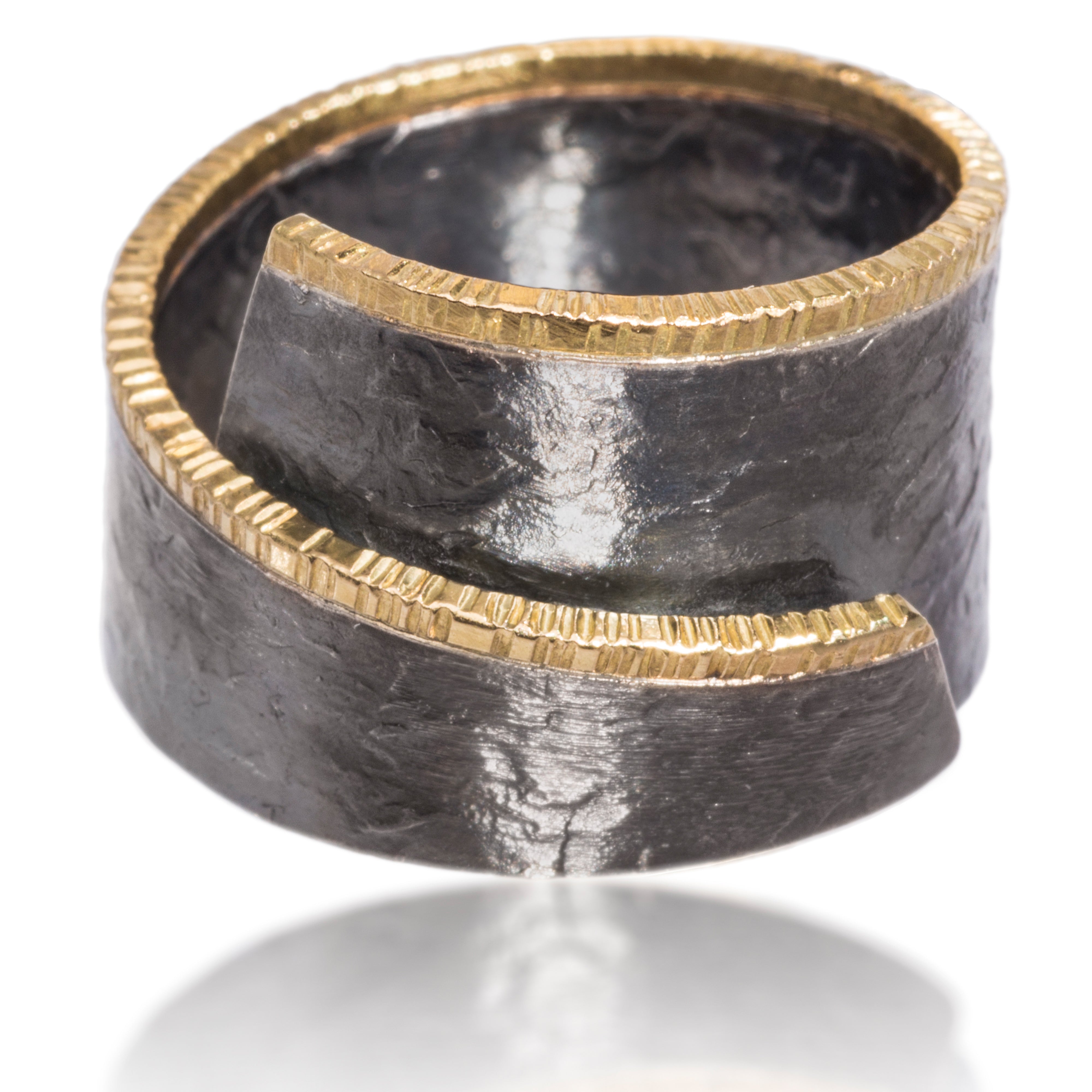 This unique and popular wrap around Cyclone ring in 18k gold and oxidized silver is available with or without prong set natural yellow diamonds. Diamonds set on a 45 degree angle to bring light and brilliance to the stones.  Hand fabricated, hammer textured. 0.0864 tcw.