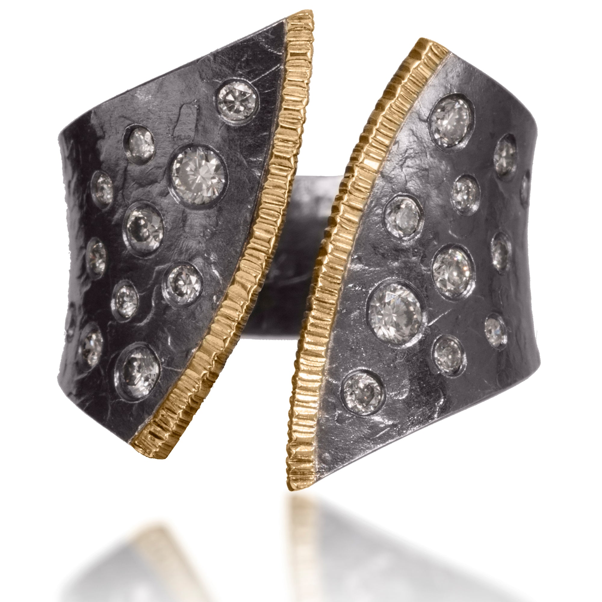 This dazzling ring has been created in 18k gold and oxidized silver and is flush set assorted diamonds It is hand fabricated and features a hammered textured. Currently available in four color ways. As shown, 0.50 tcw.