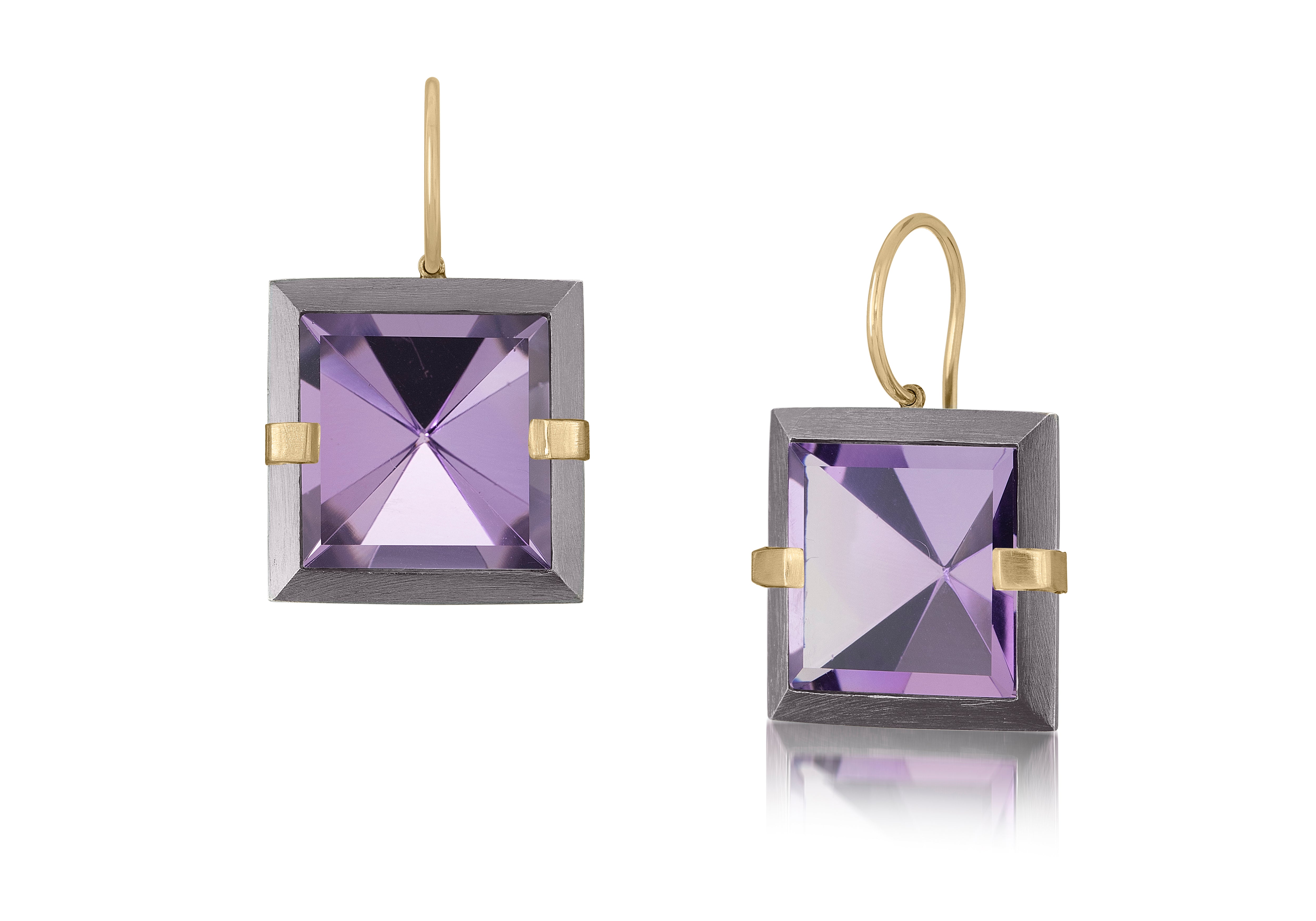 This medium style Facets drop earring is natural gemstone set in oxidized silver and 18k gold. Crisp and sparkling faceted squares of natural stone are accented with 18k gold prongs and hang from 18k gold ear wires. Gemstone 12.64- 14.56 tcw.