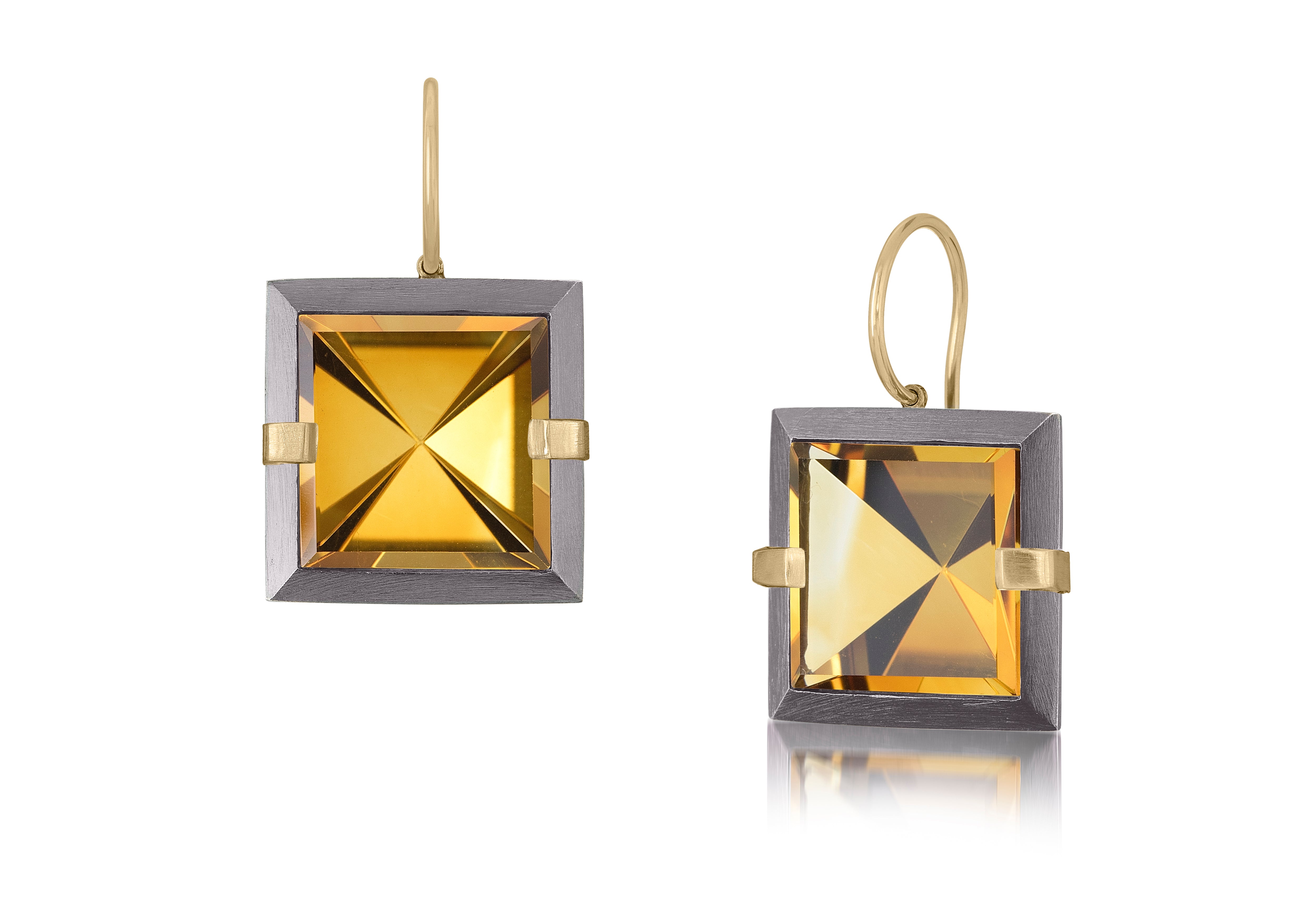 This medium style Facets drop earring is natural gemstone set in oxidized silver and 18k gold. Crisp and sparkling faceted squares of natural stone are accented with 18k gold prongs and hang from 18k gold ear wires. Gemstone 12.64- 14.56 tcw.