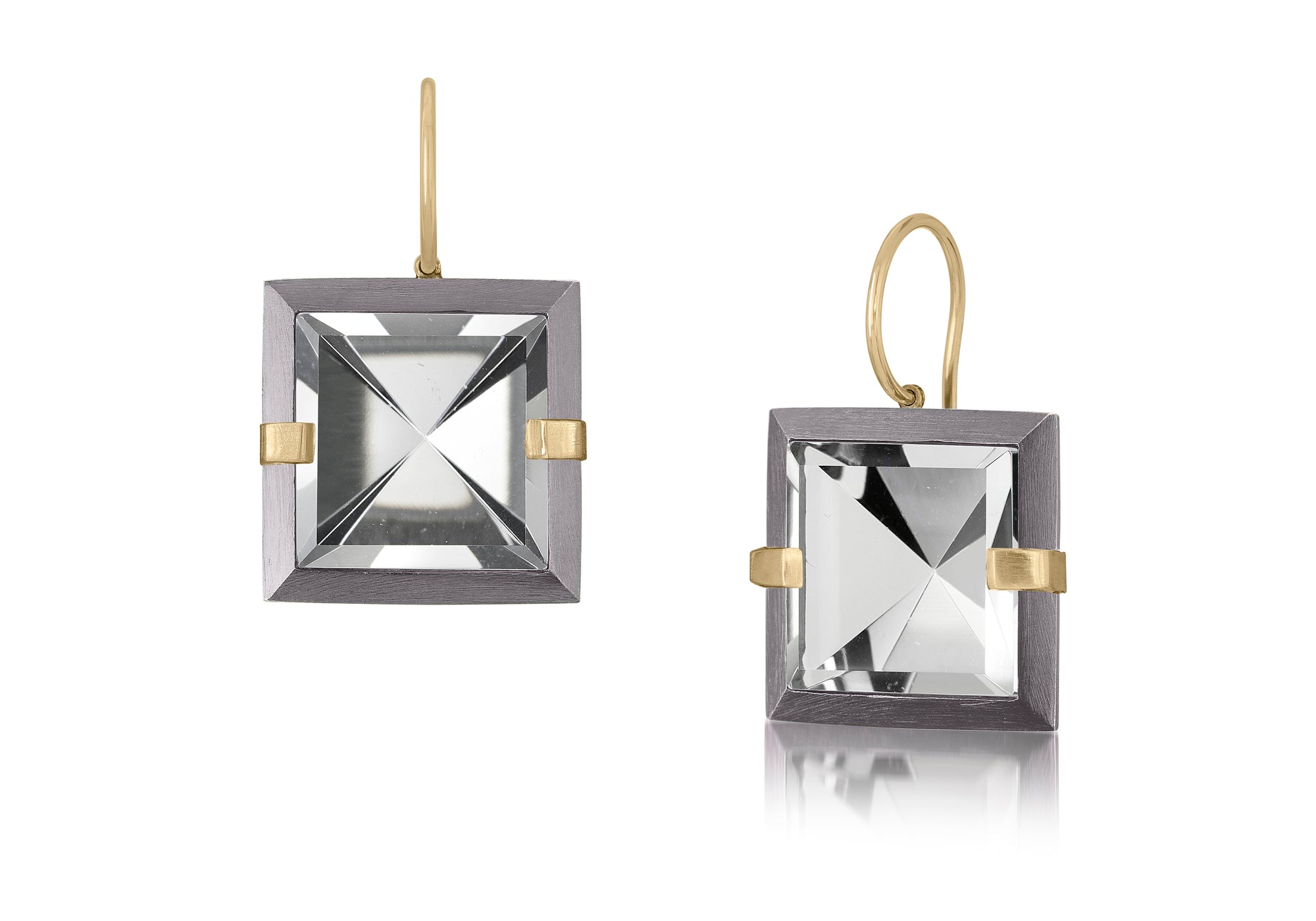 This medium style Facets drop earring is natural gemstone set in oxidized silver and 18k gold. Crisp and sparkling faceted squares of natural stone are accented with 18k gold prongs and hang from 18k gold ear wires. Gemstone 12.64- 14.56 tcw.