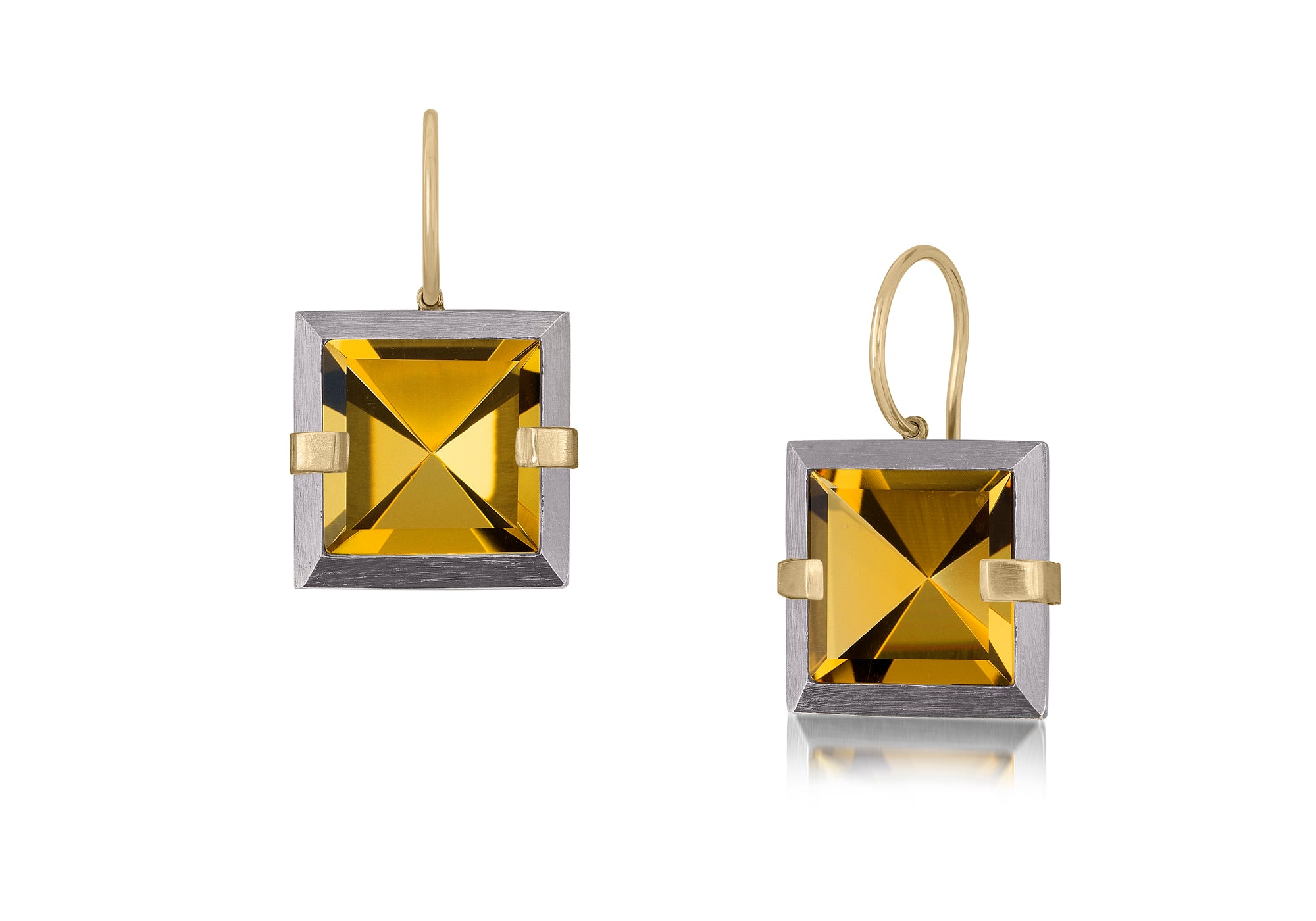 This small style Facets drop earring is natural gemstone set in oxidized sterling and 18k gold. Crisp and sparkling faceted squares of natural stone are accented with 18k gold prongs and hang from 18k gold ear wires. 7.46+ tcw.