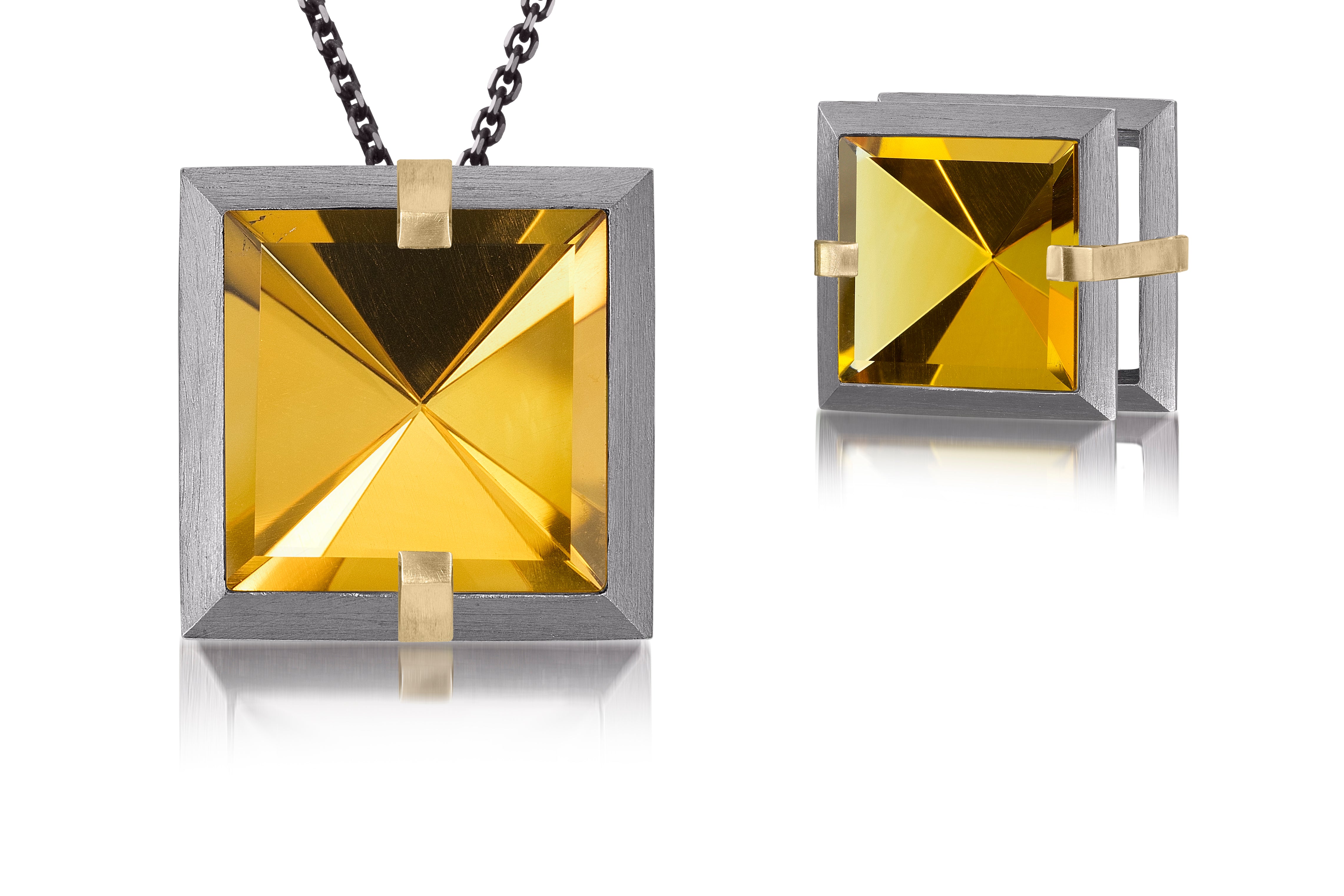 This large Facets slide pendant in oxidized sterling and 18k gold is set with natural gemstone. Crisp, hand cut, faceted gemstones are set in a square two level frame of oxidized silver, accented by 18k gold prongs. 9.29+ tcw.