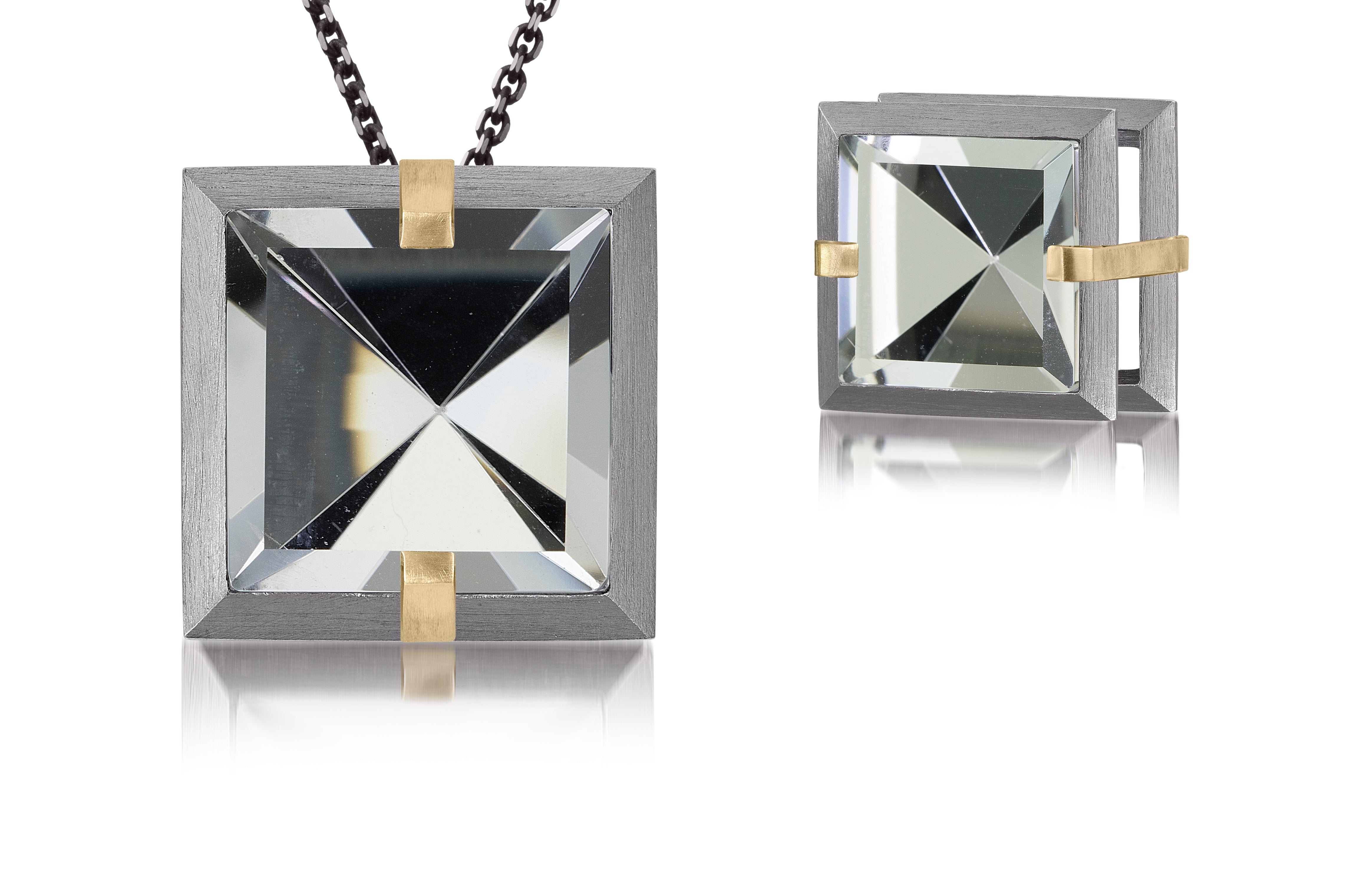 This large Facets slide pendant in oxidized sterling and 18k gold is set with natural gemstone. Crisp, hand cut, faceted gemstones are set in a square two level frame of oxidized silver, accented by 18k gold prongs. 9.29+ tcw.