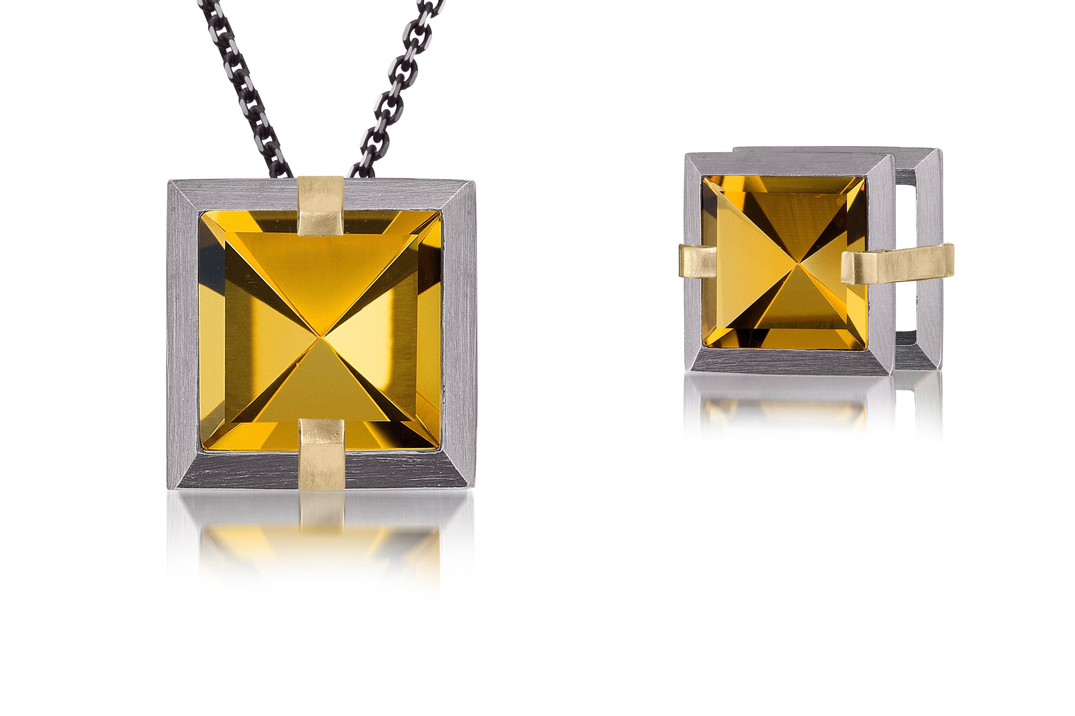 This small Facets slide pendant in oxidized sterling and 18k gold is set with natural gemstone. Crisp, hand cut, faceted gemstones are set in a square two level frame of oxidized silver, accented by 18k gold prongs. Gemstone 3.26+ tcw.