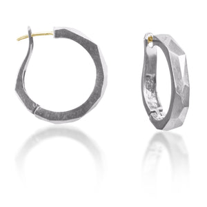Chunky bigger huggie hoops, crisply hand faceted in four color ways, oxidized silver, 18k gold, palladium or platinum. 18k ear posts and a satisfying click closer.