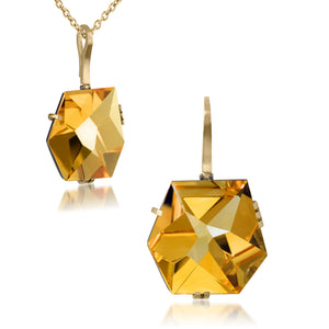 This large Facets pendant in oxidized sterling and 18k gold is set with natural gemstone. The irresistible, oversized gem pendant has amazing presence. Unique, hand cut faceted chunks of gemstone prong set in 18k gold prongs hanging from a small bail of 18k gold or oxidized silver.  
