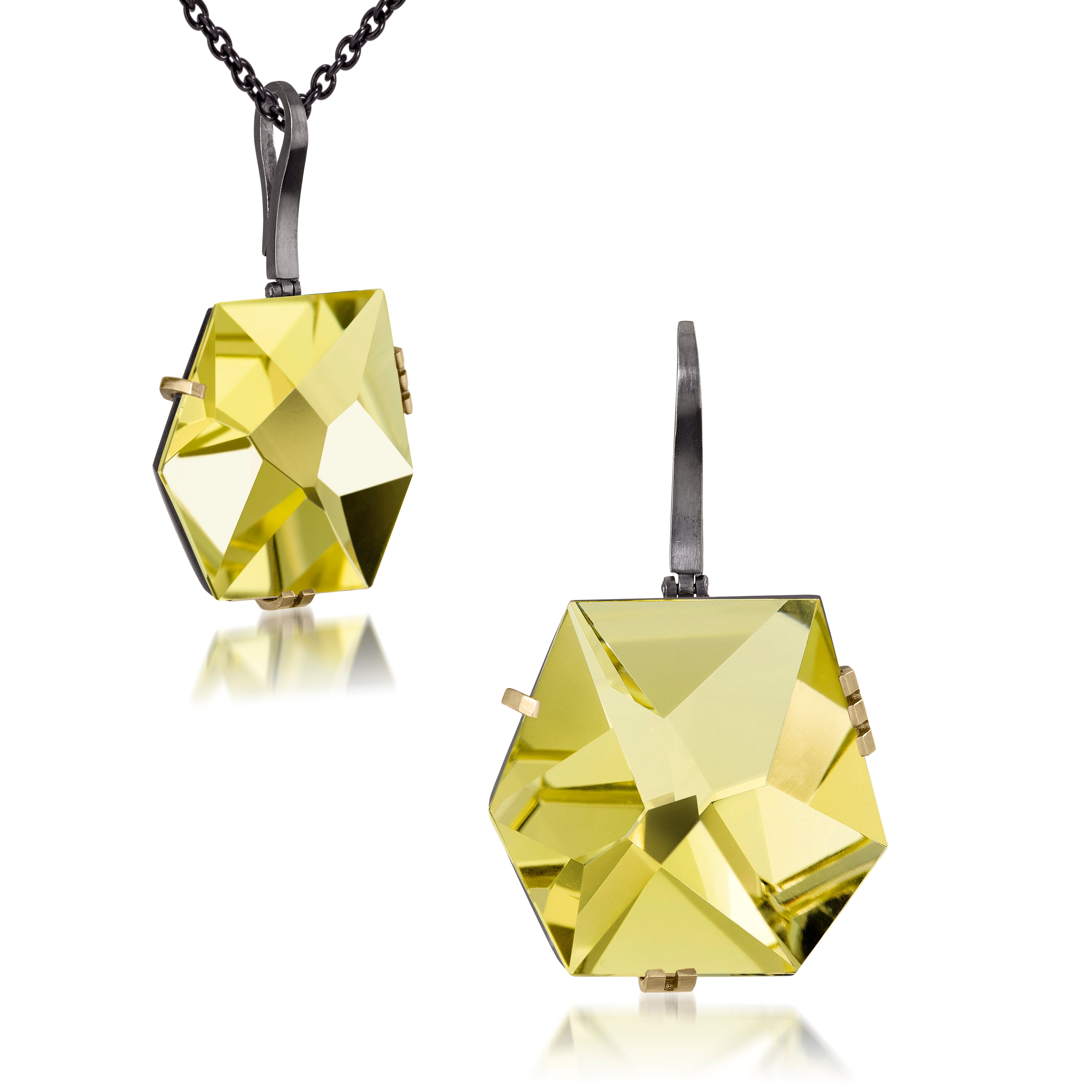 This large Facets pendant in oxidized sterling and 18k gold is set with natural gemstone. The irresistible, oversized gem pendant has amazing presence. Unique, hand cut faceted chunks of gemstone prong set in 18k gold prongs hanging from a small bail of 18k gold or oxidized silver.  