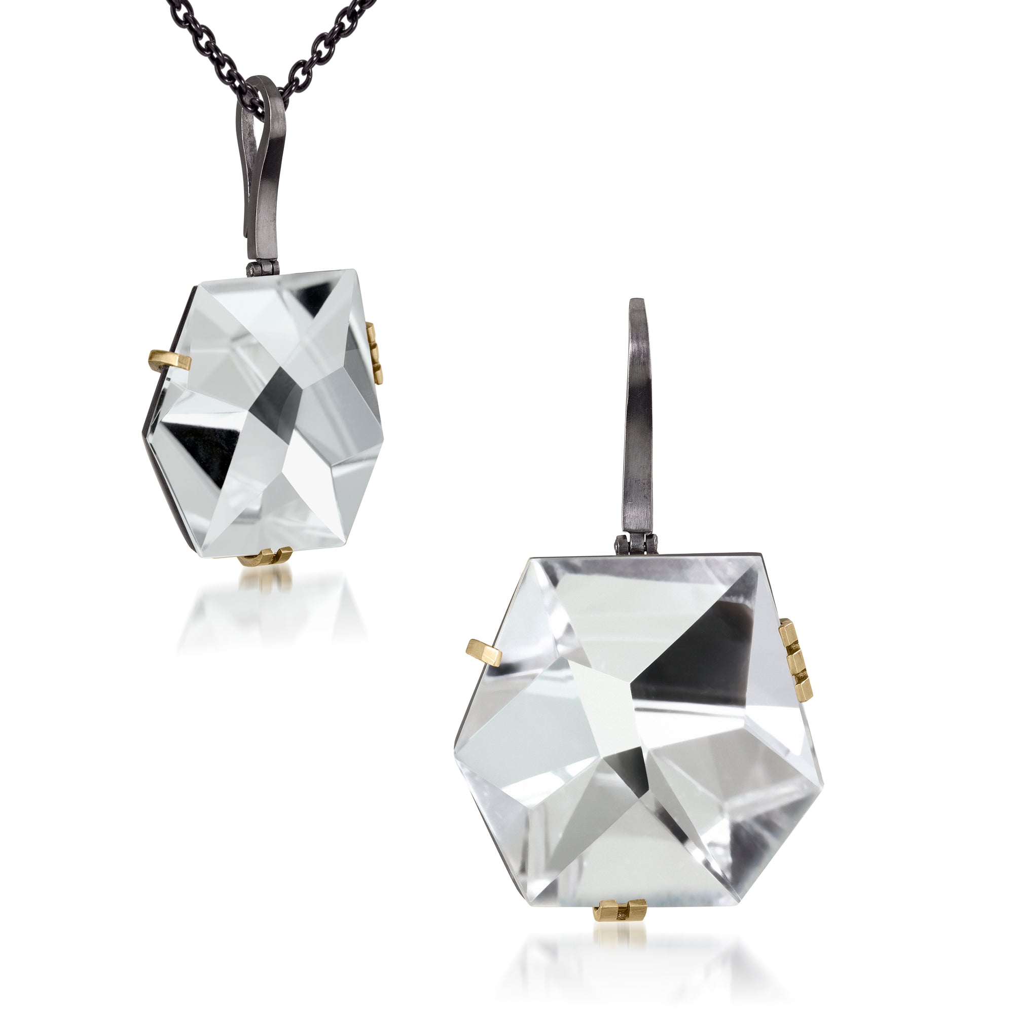 This large Facets pendant in oxidized sterling and 18k gold is set with natural gemstone. The irresistible, oversized gem pendant has amazing presence. Unique, hand cut faceted chunks of gemstone prong set in 18k gold prongs hanging from a small bail of 18k gold or oxidized silver.  