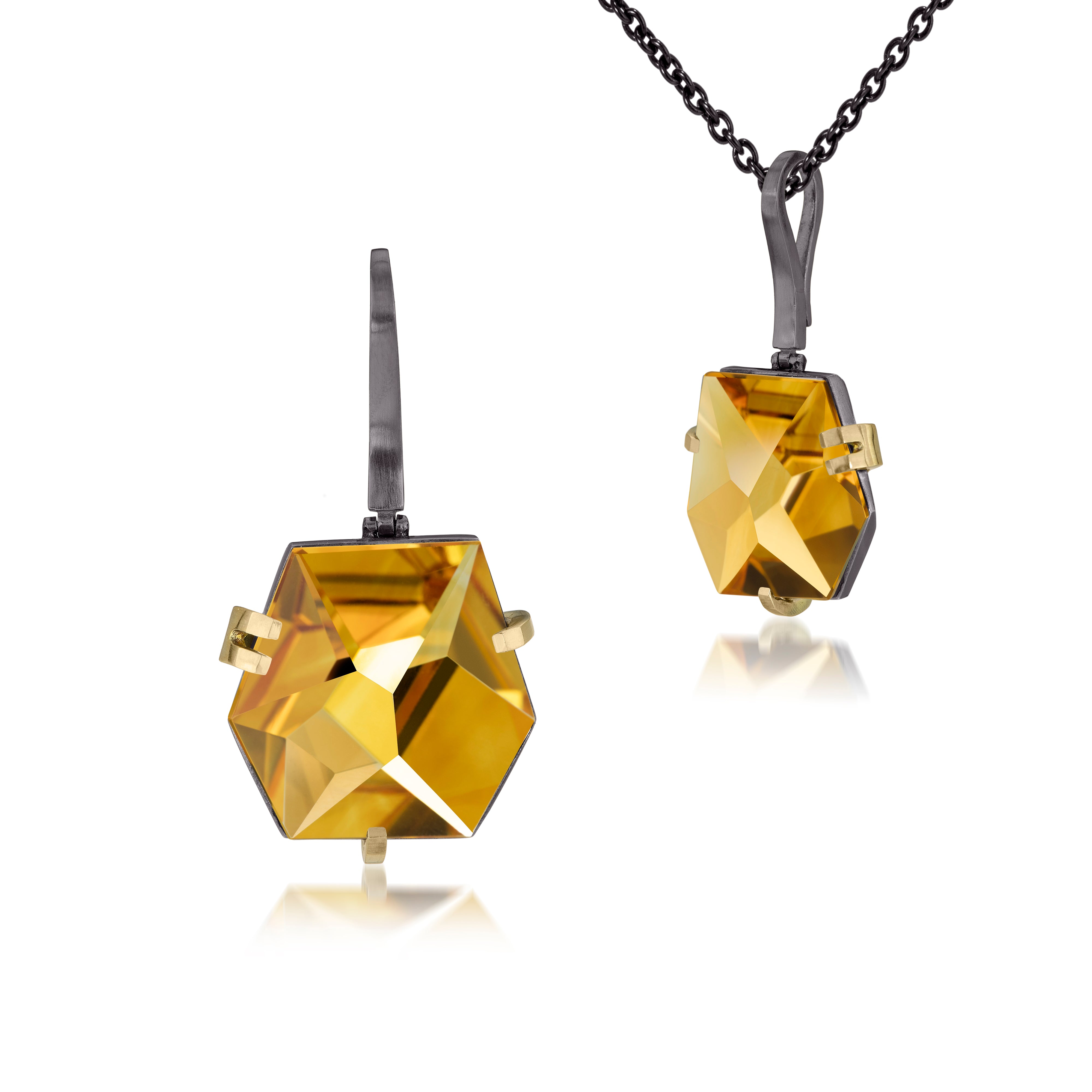 This medium size Facets pendant in oxidized sterling and 18k gold is set with natural gemstone. Unique, hand cut faceted chunks of gemstone are prong set in 18k gold prongs hang from a small bail of 18k gold or oxidized silver. 