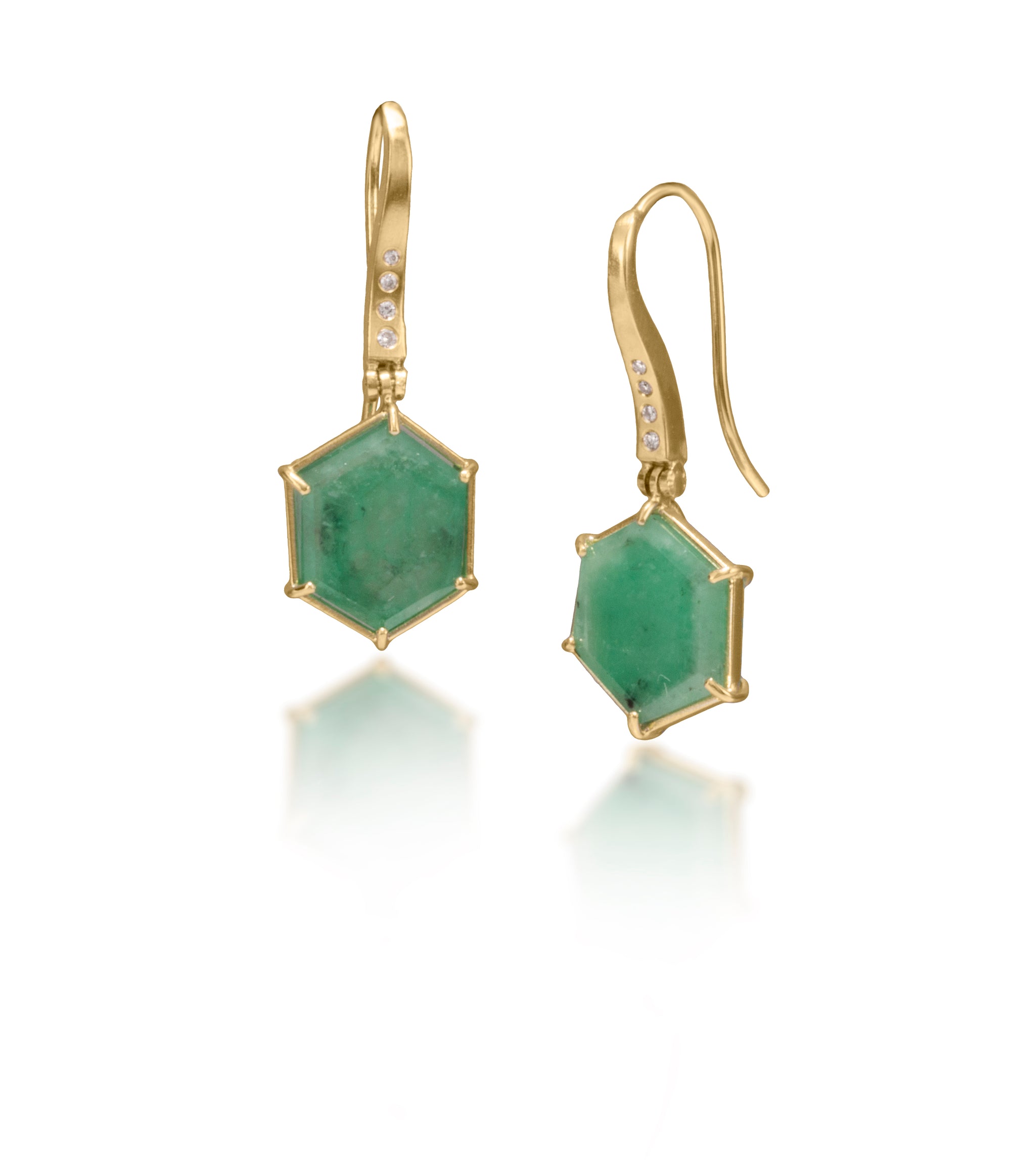 One of a kind earrings featuring 7.25 total carats natural emerald hexagons prong set in 18k and hinged from a delicate 18k ear wires, each set with 4 white diamonds. Diamond 0.06 tcw.