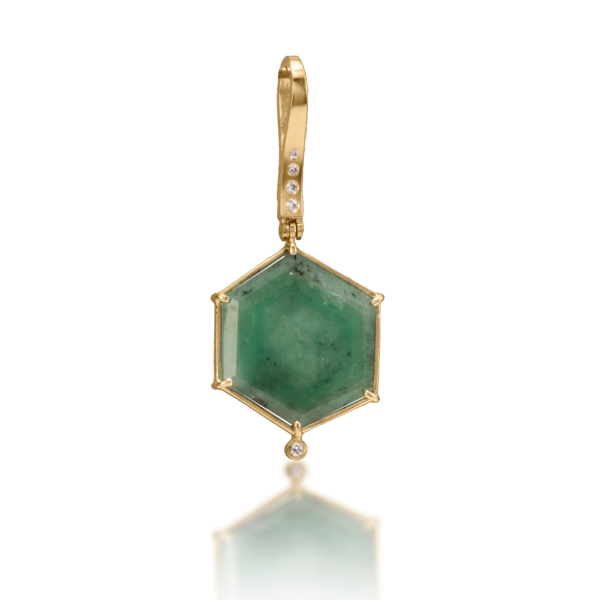 One of a kind pendant featuring 12.83 total carats natural emerald hexagon prong set in 18k and hinged from a delicate 18k gold bail set with 4 white diamonds. Diamond tcw. 0.06.