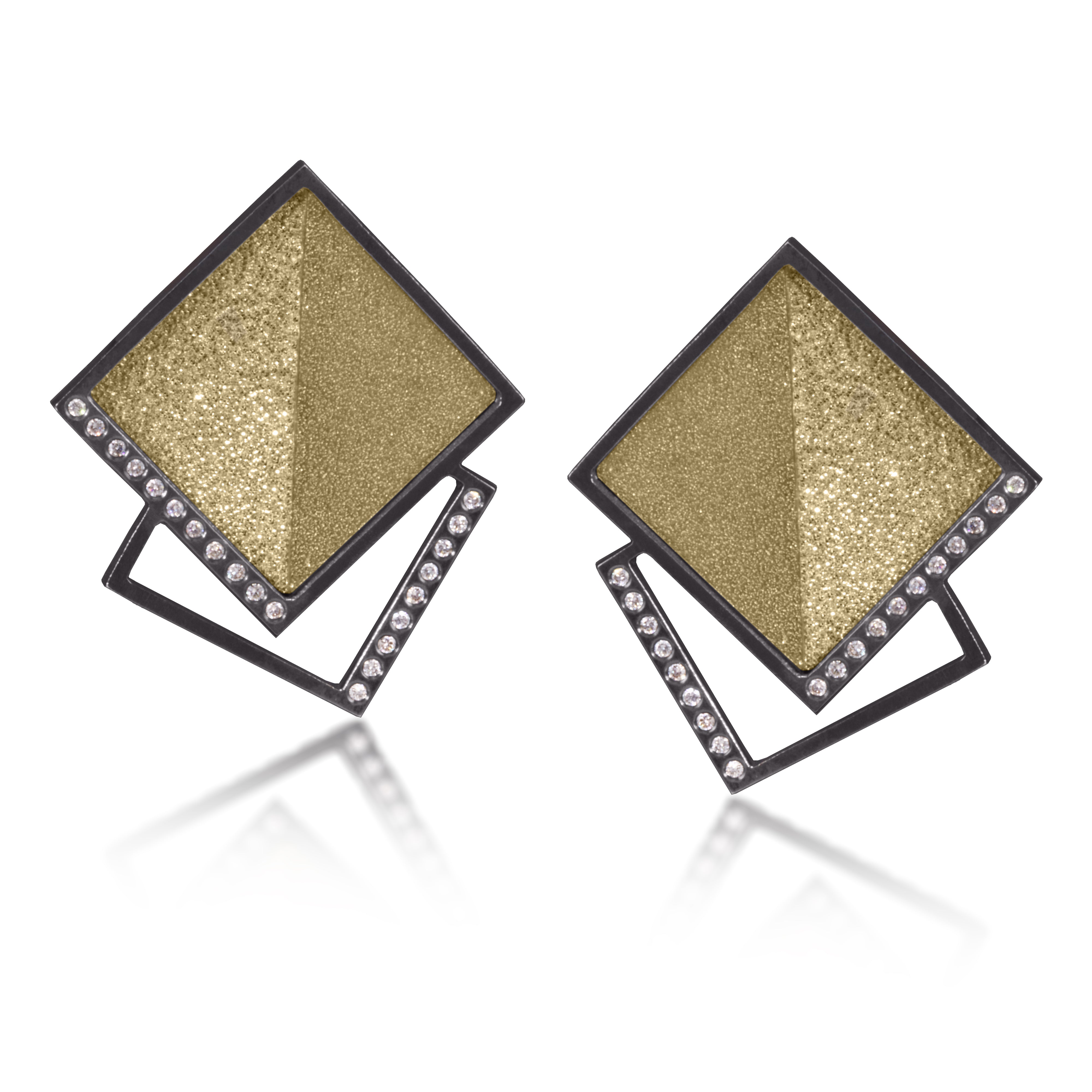 This square post earring in oxidized silver and richly textured 18k bimetal, is flush set with ideal cut white diamonds. It features 14k gold posts. Accent facet glitters with the texture of diamond facets, individually scored and textured.  Medium size 0.267 tcw, small size 0.173 tcw.