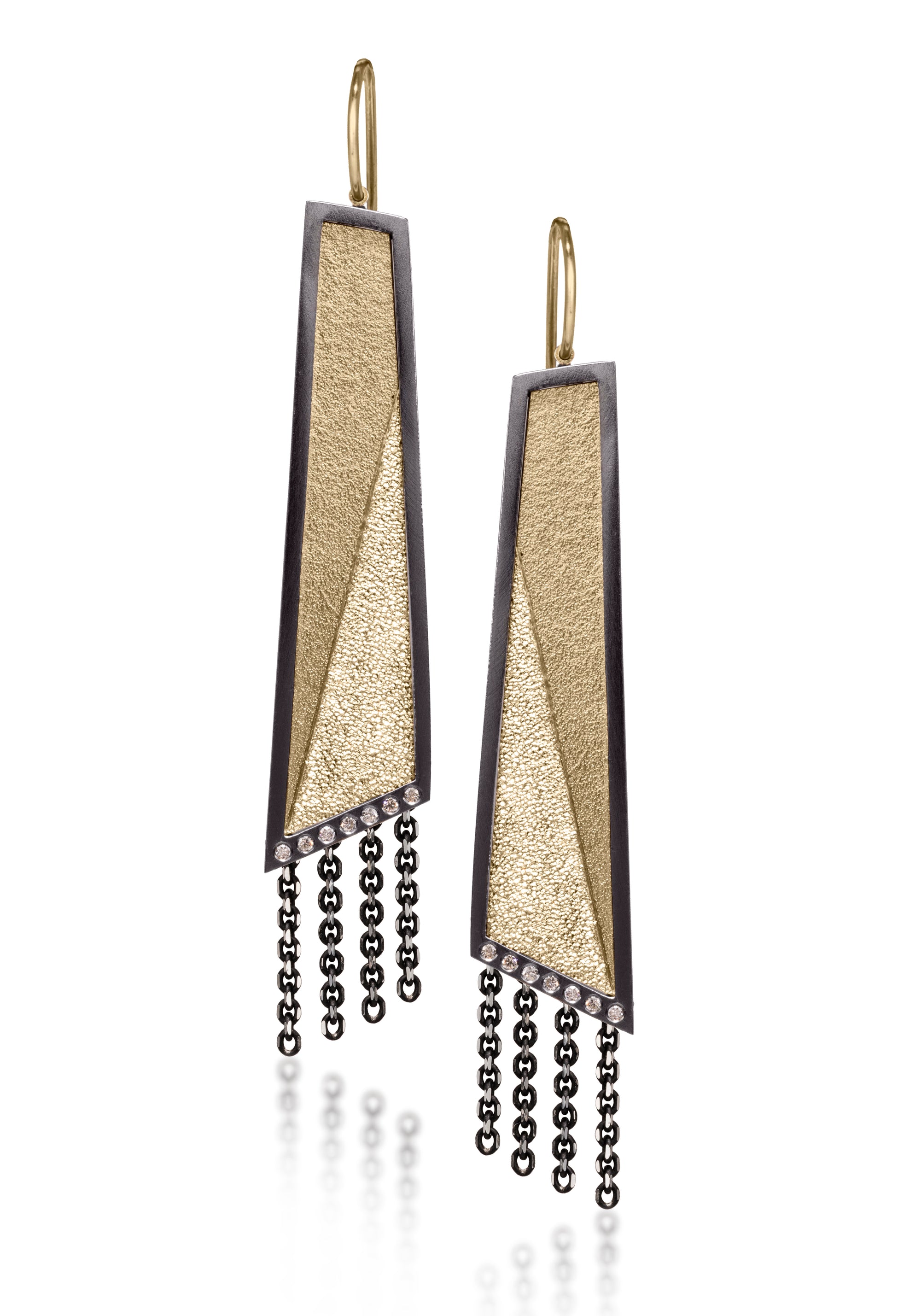 This earring in oxidized sterling silver and richly textured 18k bimetal, is flush set with ideal cut white diamonds. It features 14k gold posts or 18k gold ear wires. Accent facet glitters with the texture of diamond facets, individually scored and textured. Elongated shape, size large. Available in post, post fringe, drop and drop fringe styles.  0.0966 tcw
