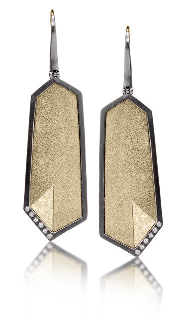 This oxidized sterling silver and richly textured 18k bimetal earring is flush set with ideal cut white diamonds. Hinged, tapered earwire top with 18k gold earwires. Accent facet glitters with the texture of diamond facets, individually scored and textured.  0.0828 tcw