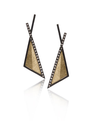 This oxidized sterling silver and richly textured 18k bimetal earring is flush set with ideal cut white diamonds. Hinged top with 14k gold posts. Accent facet glitters with the texture of diamond facets, individually scored and textured. Available in post and fringe styles.  0.276 tcw