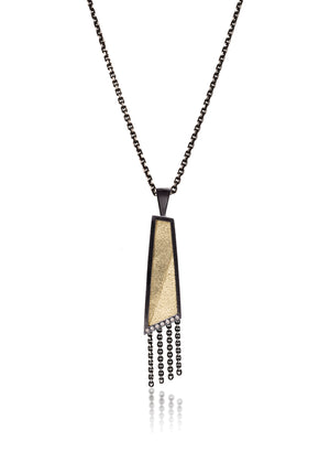 This oxidized sterling silver and richly textured 18k bimetal pendant is flush set with ideal cut white diamonds.  Accent facet glitters with the texture of diamond facets, individually scored and textured.  Elongated shape in medium length, available with or without diamond cut chain fringe. 0.0483 tcw 