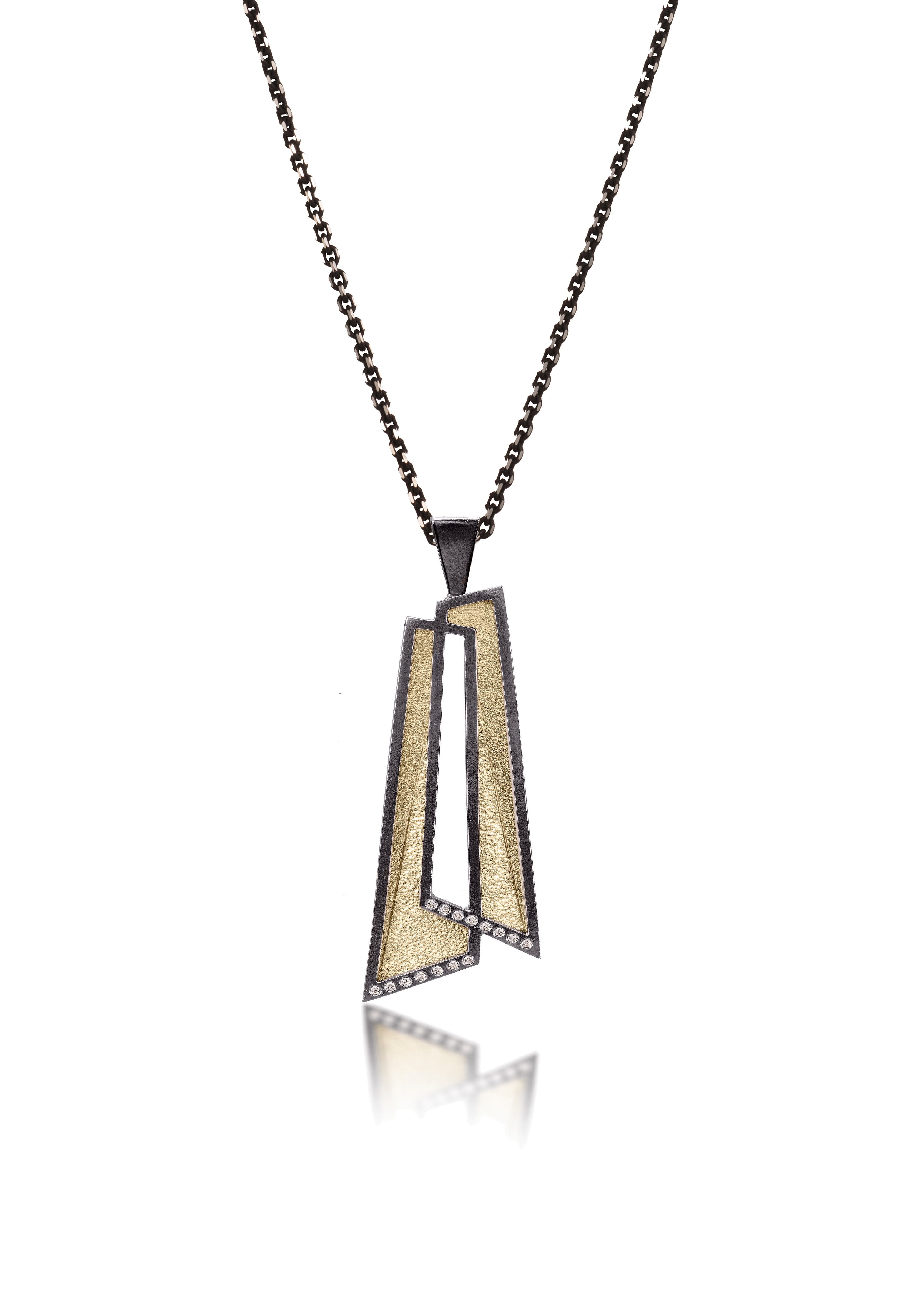 This oxidized sterling silver and richly textured 18k bimetal pendant is flush set with ideal cut white diamonds.  Accent facet glitters with the texture of diamond facets, individually scored and textured. Overlapping shapes with open areas.  Available with oxidized silver or 18k gold bail.  0.0483 tcw